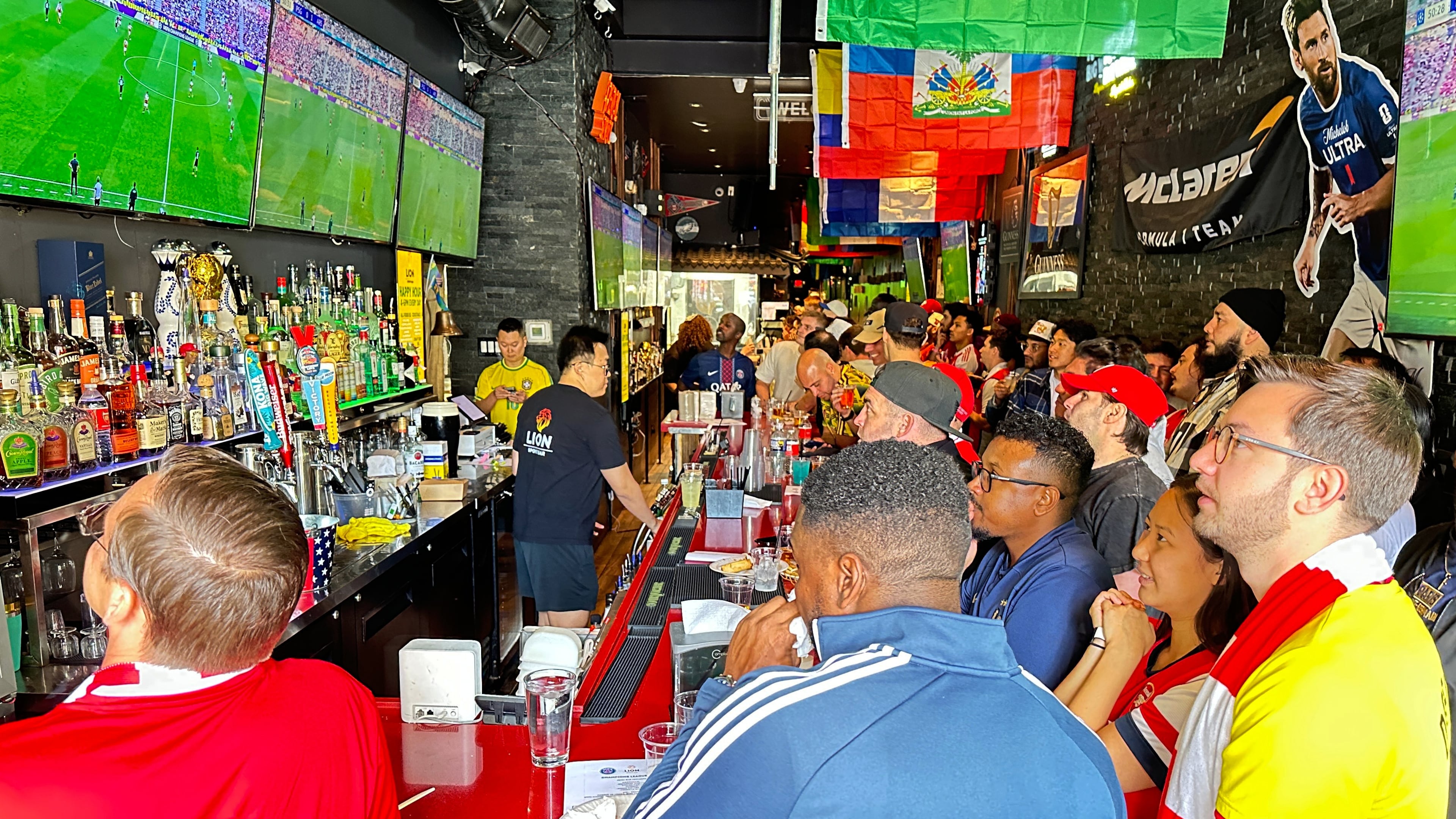 Fans watch a Champion league soccer match between Arsenal and Paris Saint-Germain at the Lion Sports Bar, Saturday, May 30, 2026, in Philadelphia. (AP Photo/Tassanee Vejpongsa)