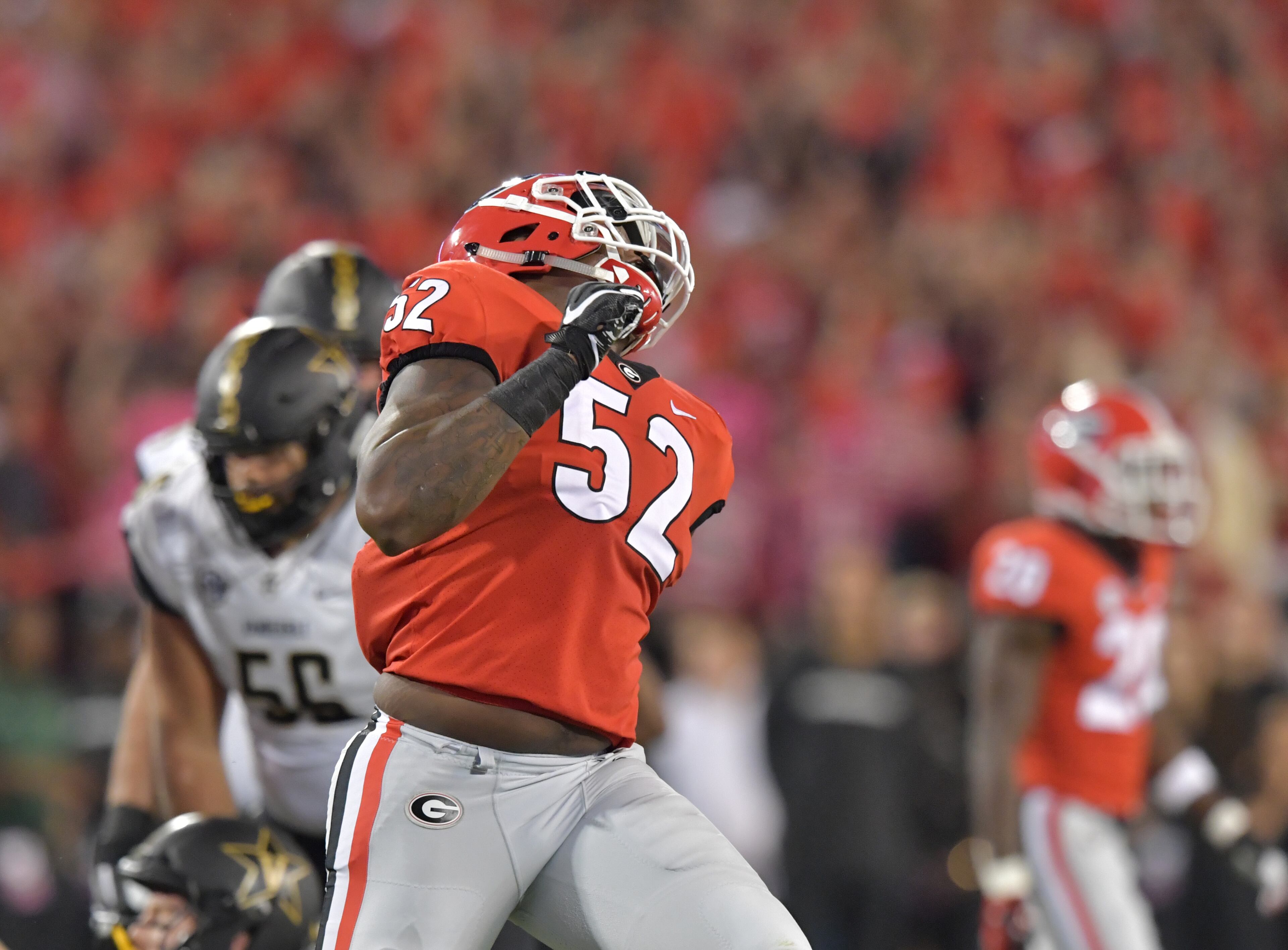 October 6, 2018 Athens - Georgia defensive lineman Tyler Clark (52) celebrates after he blocked a pass by Vanderbilt quarterback Kyle Shurmur (14) in the first half during a NCAA college football game at Sanford Stadium in Athens on Saturday, October 6, 2018. HYOSUB SHIN / HSHIN@AJC.COM