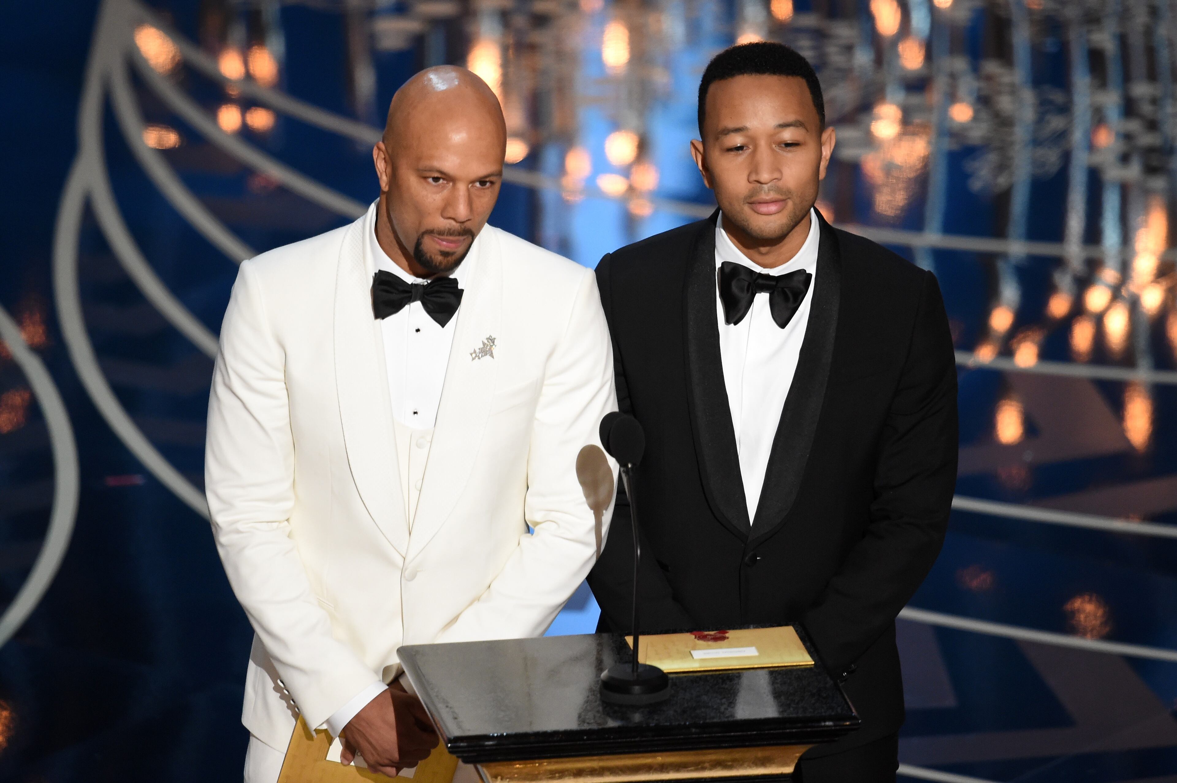 HOLLYWOOD, CA - FEBRUARY 28: Rapper-actor Common (L) and musician John Legend speak onstage during the 88th Annual Academy Awards at the Dolby Theatre on February 28, 2016 in Hollywood, California. (Photo by Kevin Winter/Getty Images)