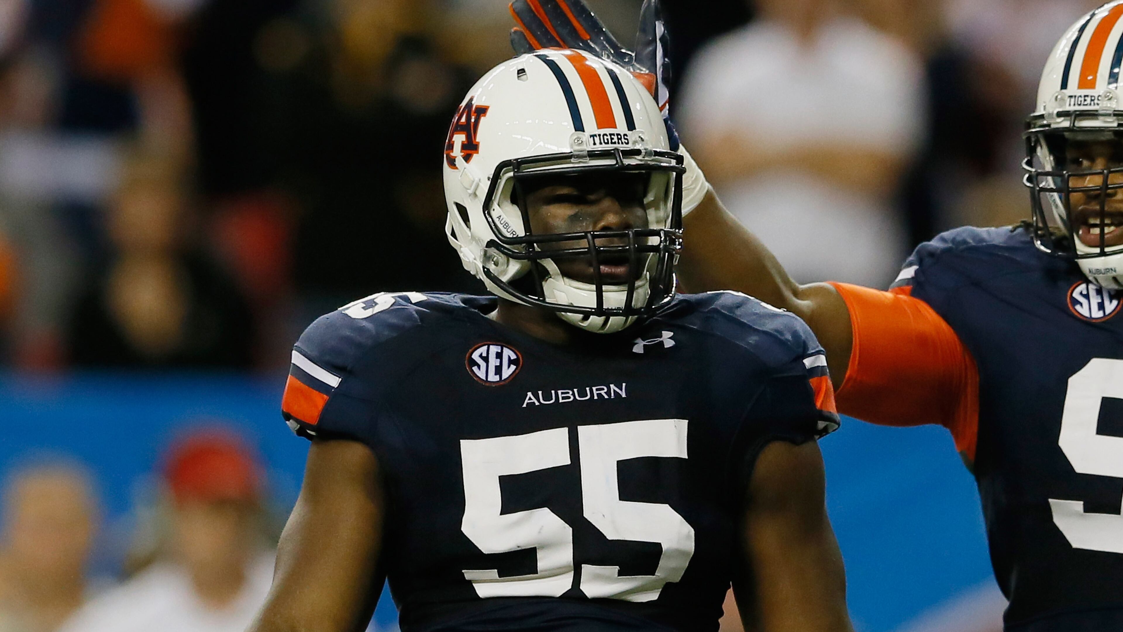 ATLANTA, GA - DECEMBER 07: Carl Lawson #55 of the Auburn Tigers celebrates a sack with teammate Kenneth Carter #92 in the second quarter against the Missouri Tigers during the SEC Championship Game at Georgia Dome on December 7, 2013 in Atlanta, Georgia. (Photo by Kevin C. Cox/Getty Images)