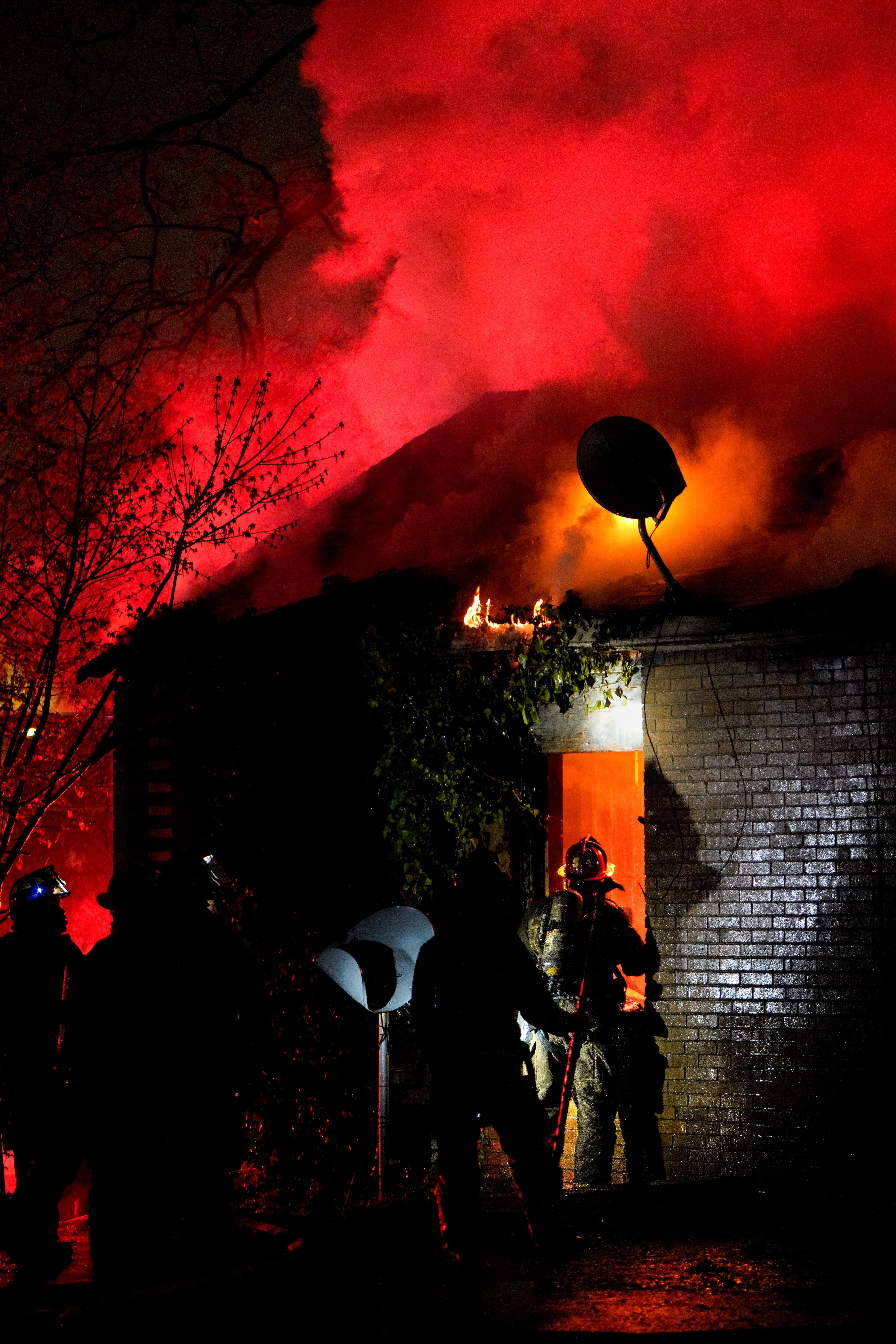 Atlanta firefighters battle a house fire on Joseph E. Boone Blvd early Friday.