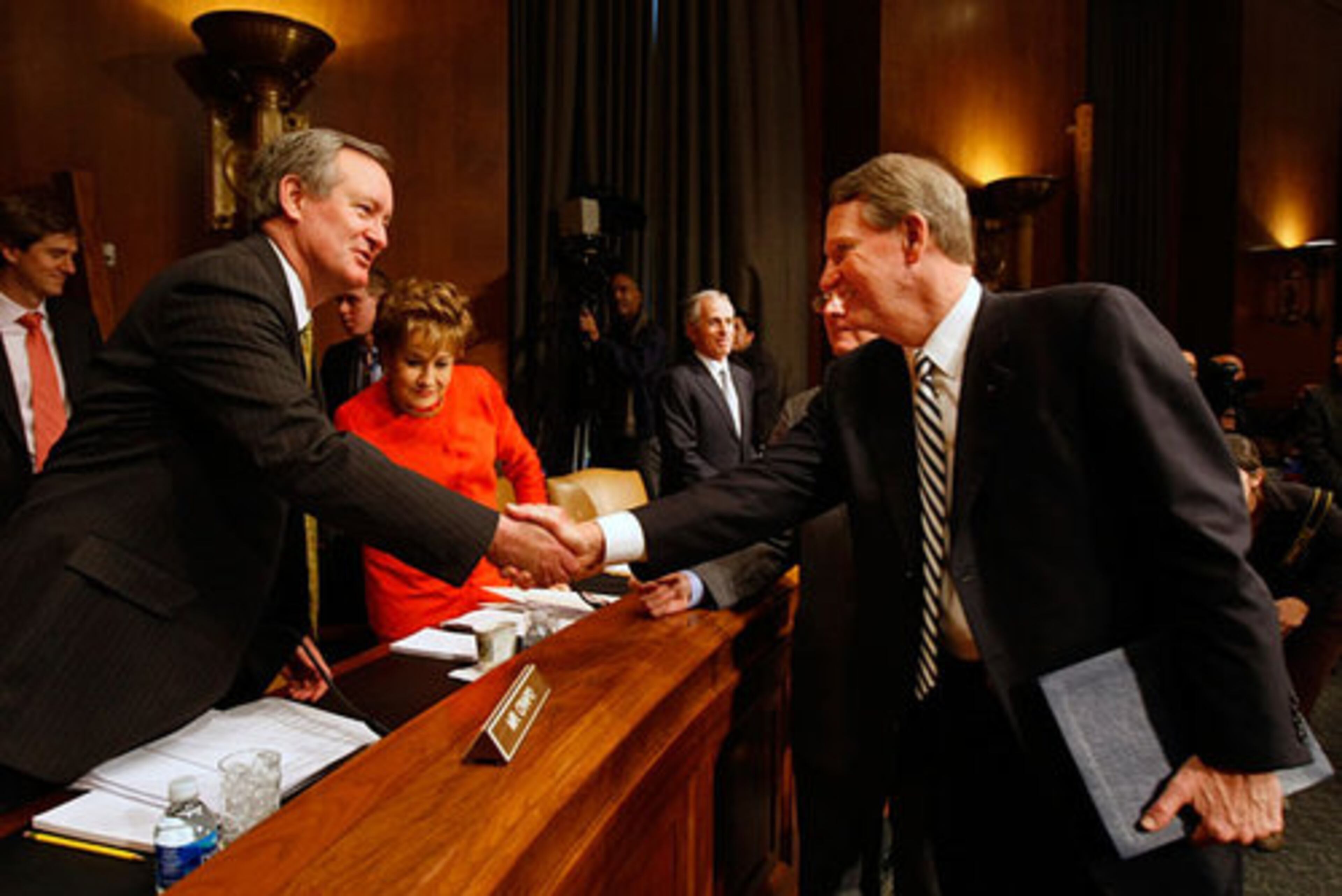 Senate Banking Committee member Sen. Mike Crapo, R-Idaho, left, greets Wagoner.