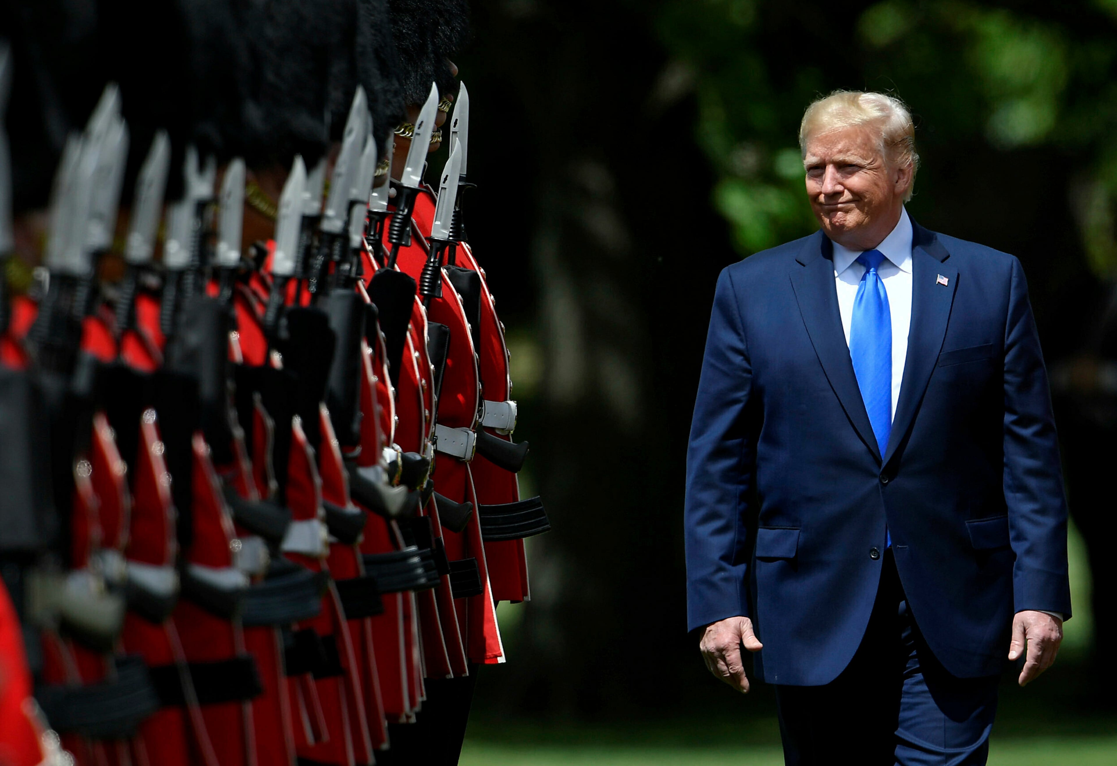 U.S. President Donald Trump inspects an honour guard during a welcome ceremony in the garden of Buckingham Palace, in London, for President Donald Trump and first lady Melania Trump Monday, June 3, 2019, on the first day of a three day state visit to Britain. (Toby Melville/Pool via AP)