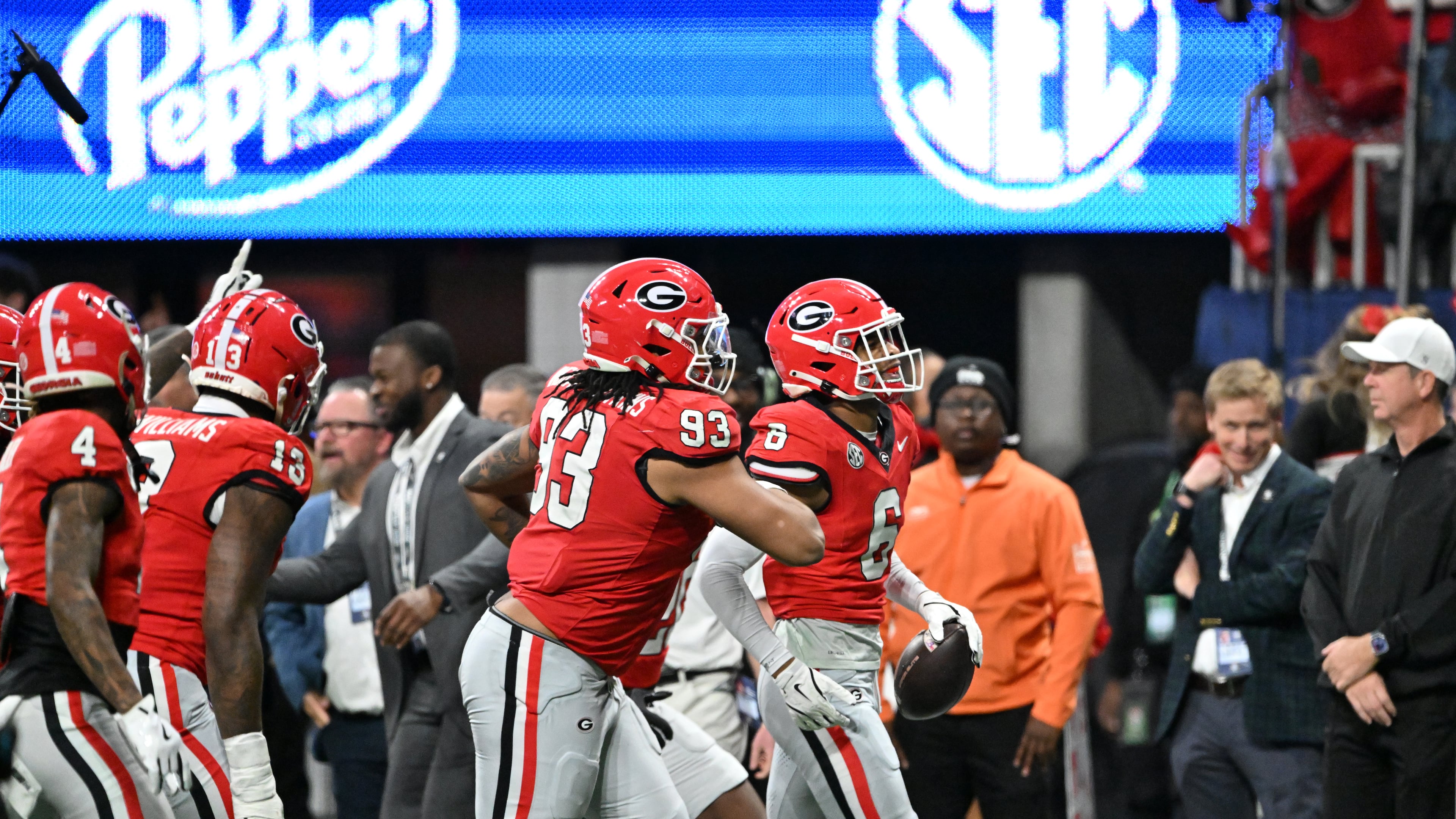 Georgia defensive back Daylen Everette (right) intercepts a pass during the SEC championship football game at the Mercedes-Benz Stadium on Saturday, Dec. 7, 2024, in Atlanta. Winning the SEC championship game last season guaranteed Georgia a first-round bye. (Hyosub Shin/AJC 2024)
