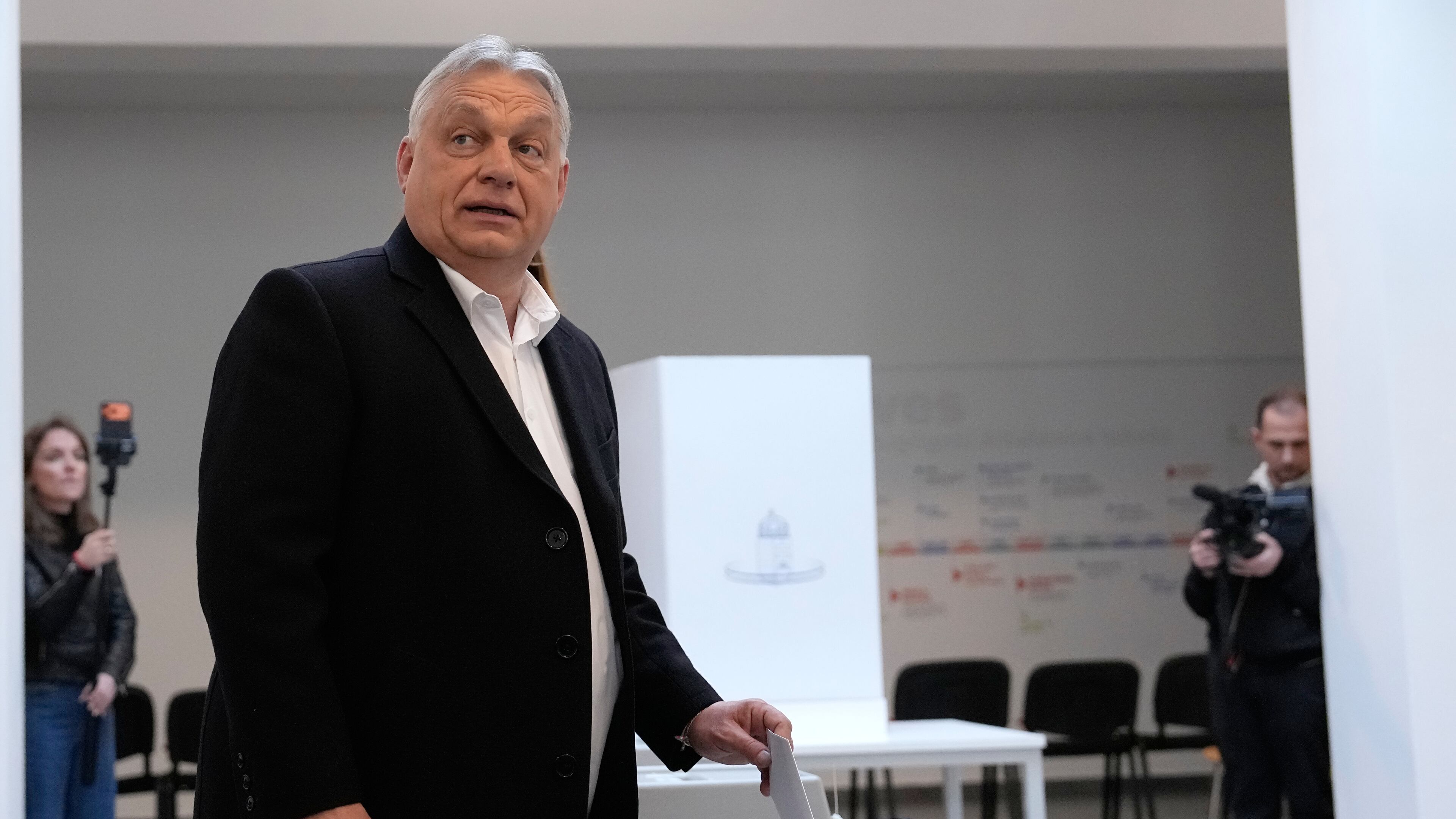 Hungary's Prime Minister Viktor Orban casts his vote in Budapest, Hungary, Sunday, April 12, 2026. (AP Photo/Petr David Josek)