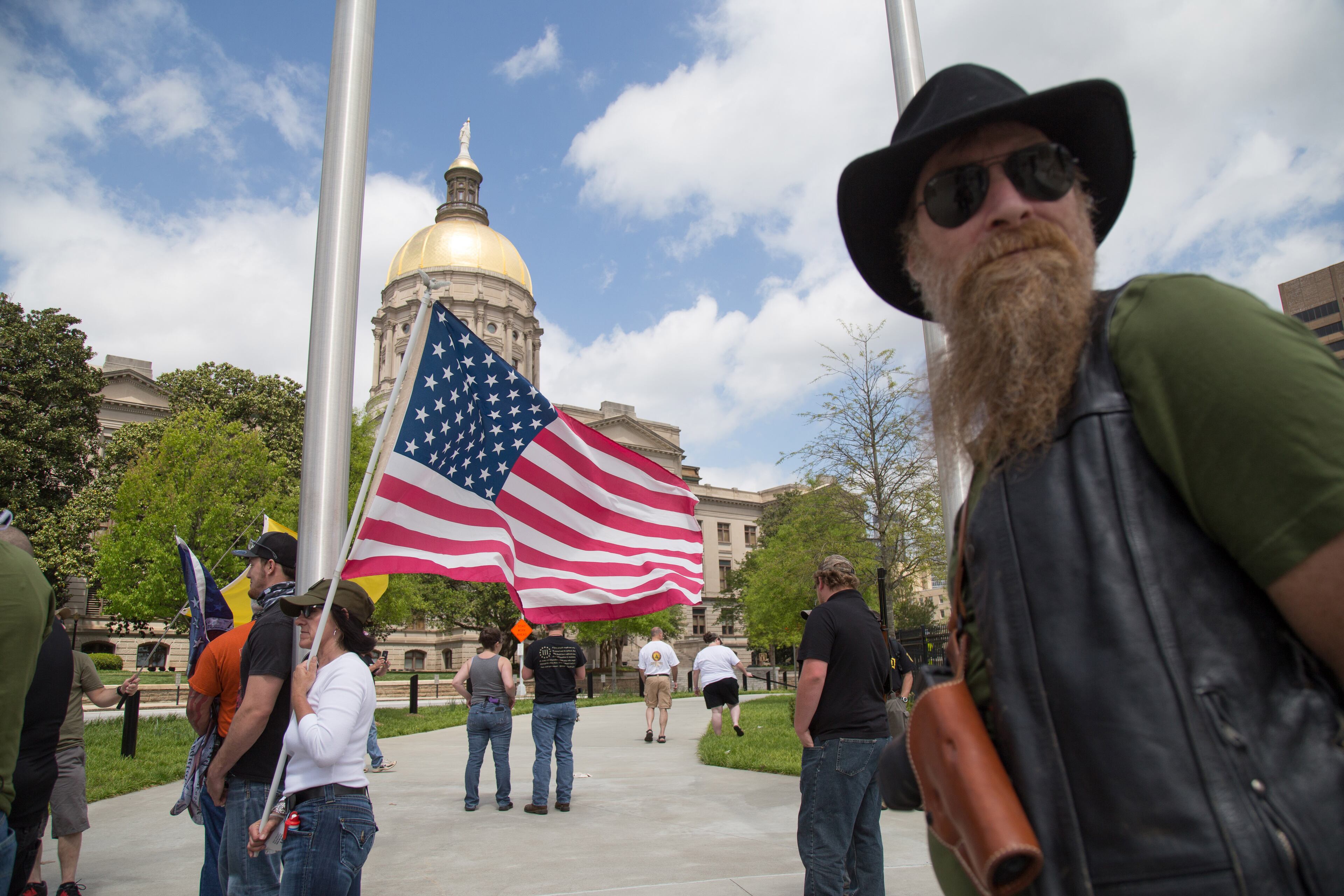 Shawn Zarbrook (right) waits for the start of the gun rights rally at the Georgia State Capital Saturday, April 14, 2018. Recent protests in the wake of the deadly Parkland, Florida, school shooting have led to concerns about the Second Amendment. STEVE SCHAEFER / SPECIAL TO THE AJC