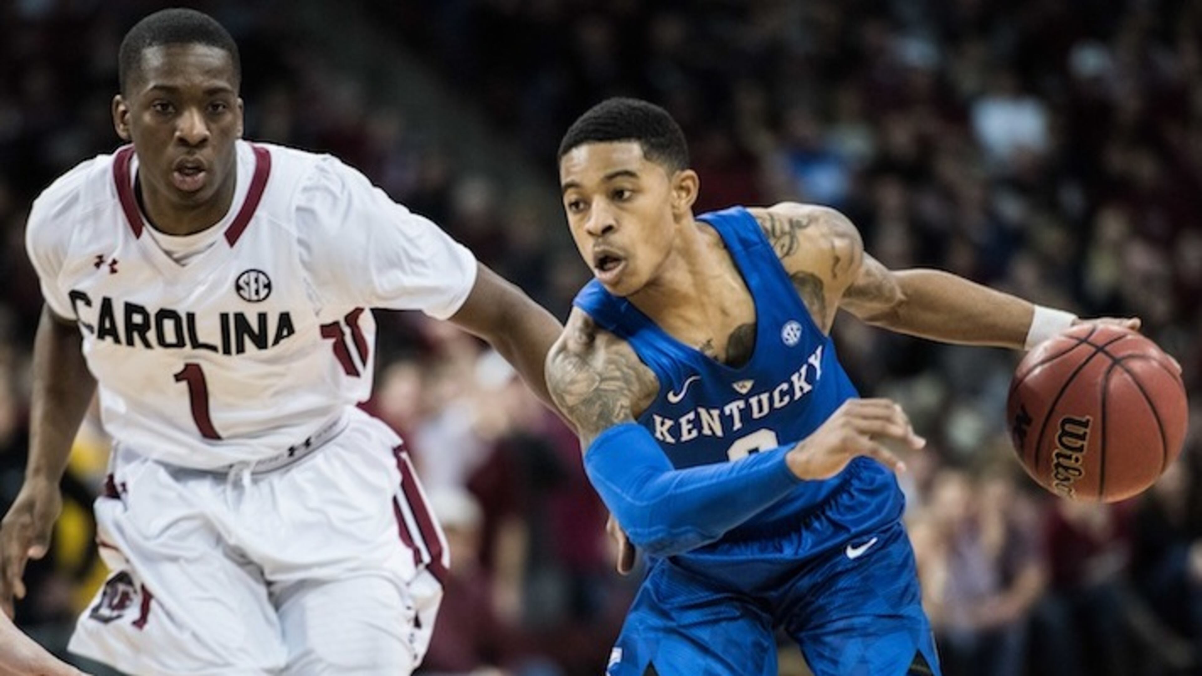 Kentucky guard Tyler Ulis, right, pushes the ball down court against South Carolina guard Marcus Stroman (1) during the second half of an NCAA college basketball game Saturday, Feb. 13, 2016, in Columbia, S.C. Kentucky defeated South Carolina 89-62. (AP Photo/Sean Rayford)