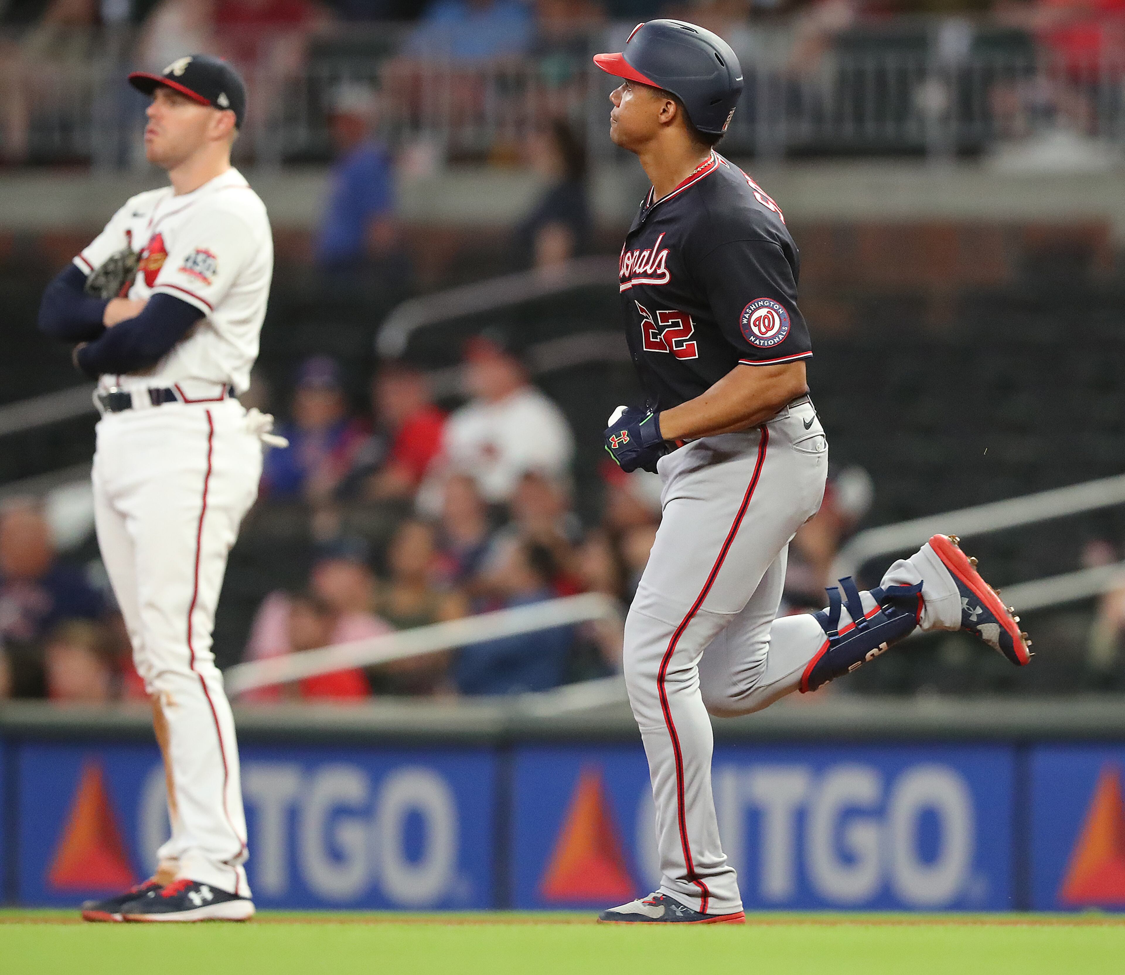 Braves first baseman Freddie Freeman is in the background as Washington Nationals outfielder Juan Soto rounds the bases on a solo homer. “Curtis Compton / Curtis.Compton@ajc.com”