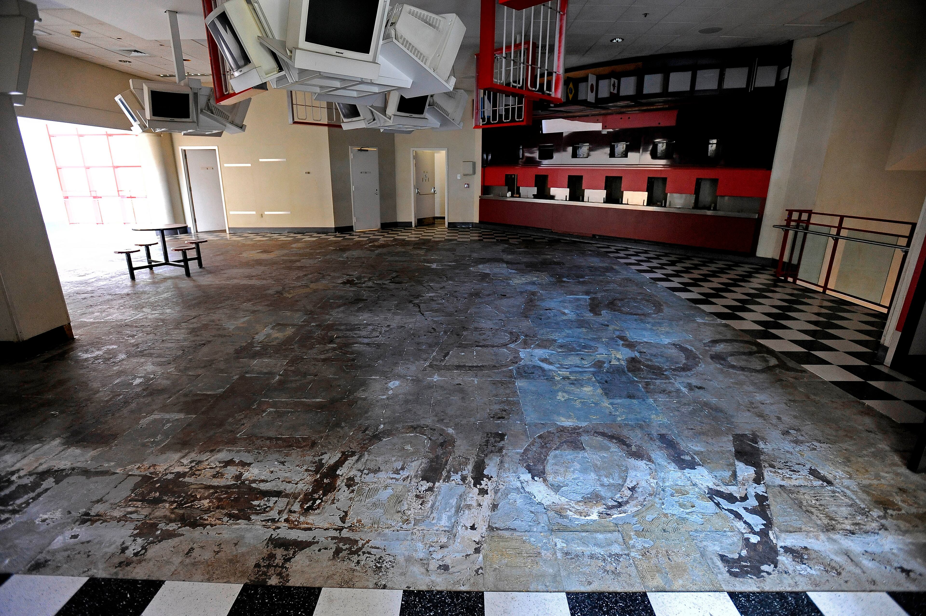 jump page One can barely make out the faint lines of slogans like "enjoy" etched into the checkered floor at the former World of Coca-Cola building next to Underground Atlanta since the soft drink company moved its museum to Centennial Park six years ago. The facility, currently managed by the State Building Authority, is shown on Friday, June 28, 2013, in Atlanta. David Tulis / AJC Special