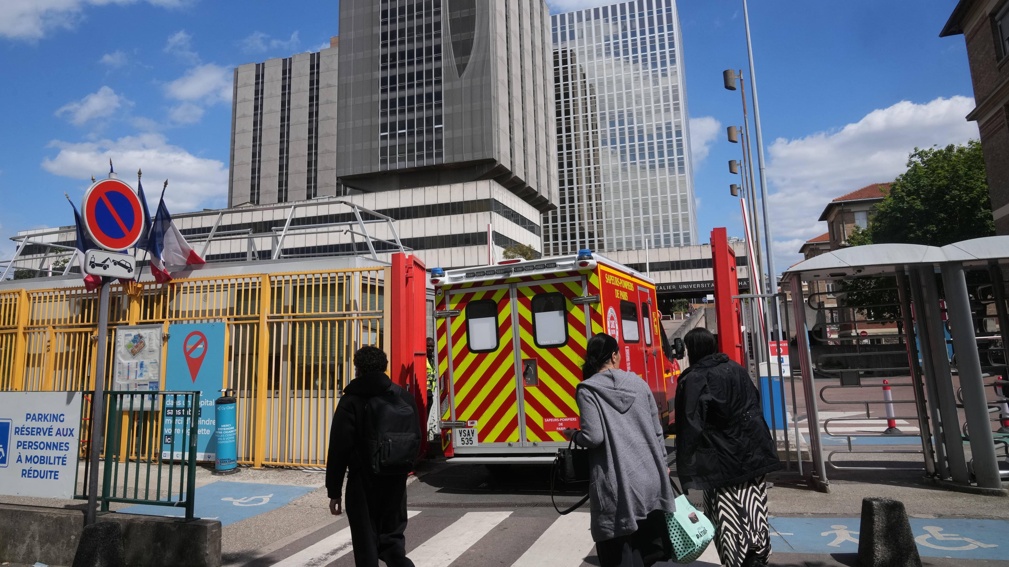 An ambulance enters the Bichat Hospital where a woman who tested positive for hantavirus remains in intensive care, in Paris, Tuesday, May 12, 2026. (AP Photo/Michel Euler)