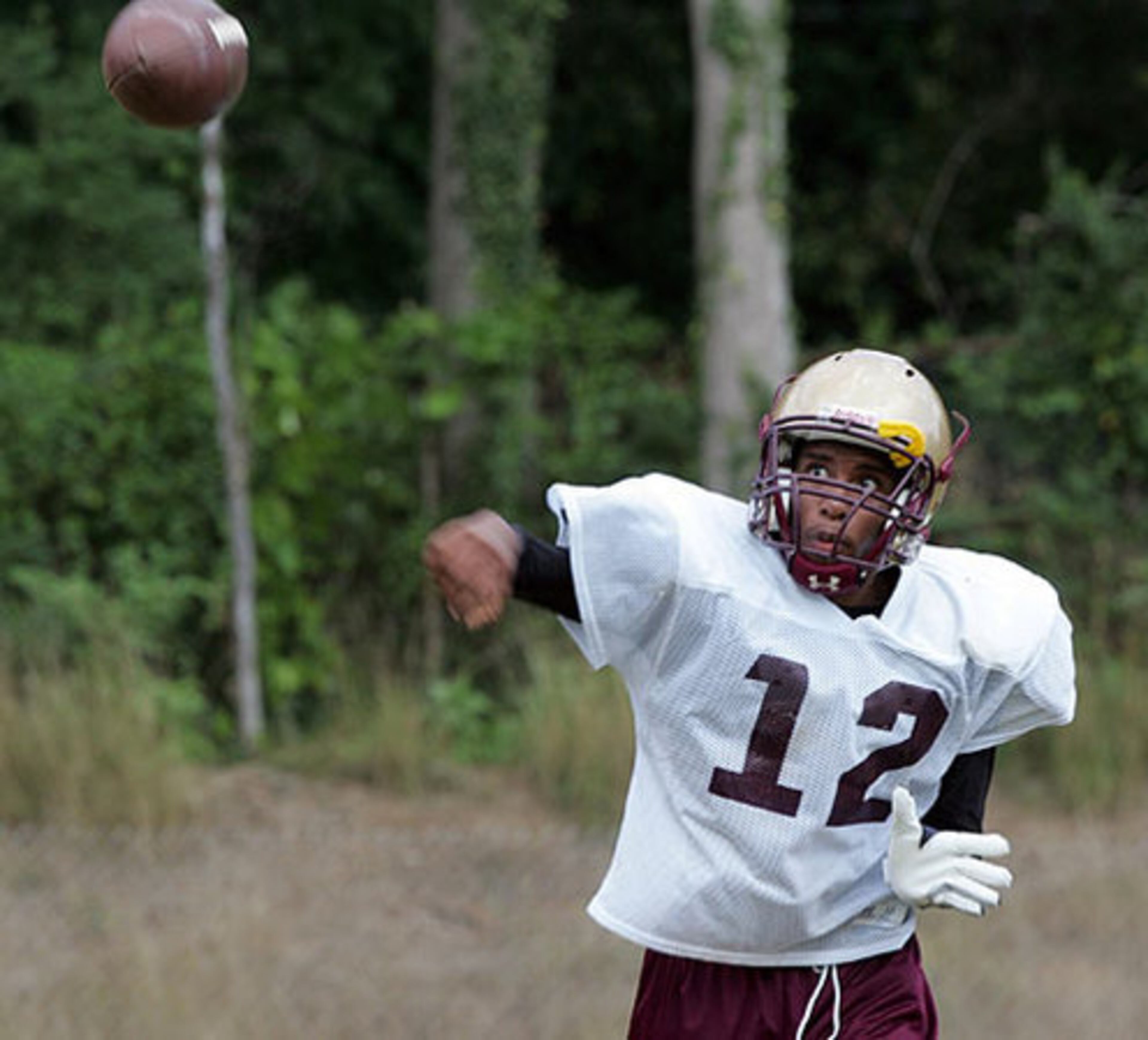 Quarterback Michael Morris practices plays.