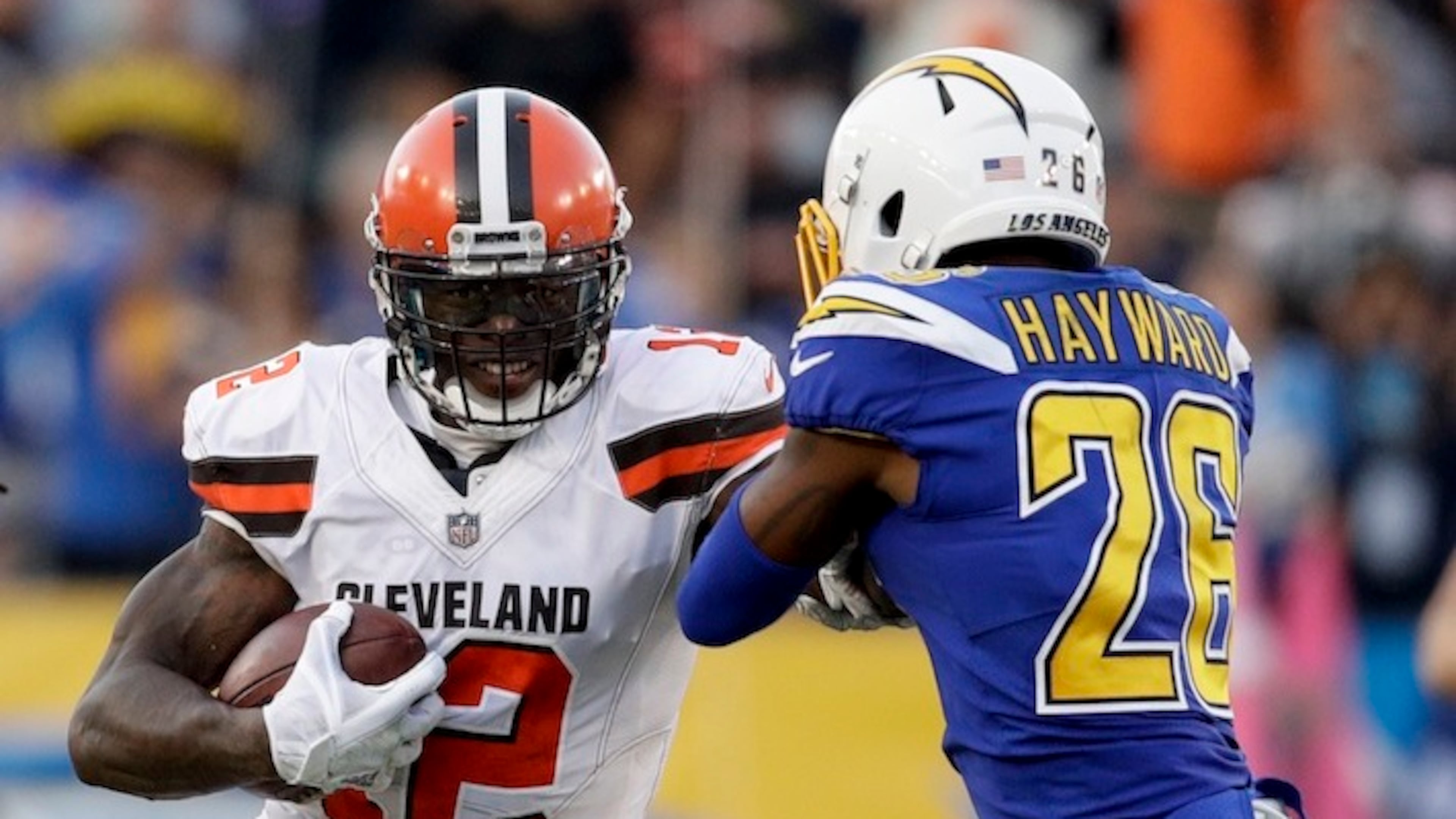Browns wide receiver Josh Gordon runs against Chargers cornerback Casey Hayward. Hayward agreed to a two-year contract with the Falcons, according to NFL Media. His agent confirmed the report. (AP Photo/Jae C. Hong)