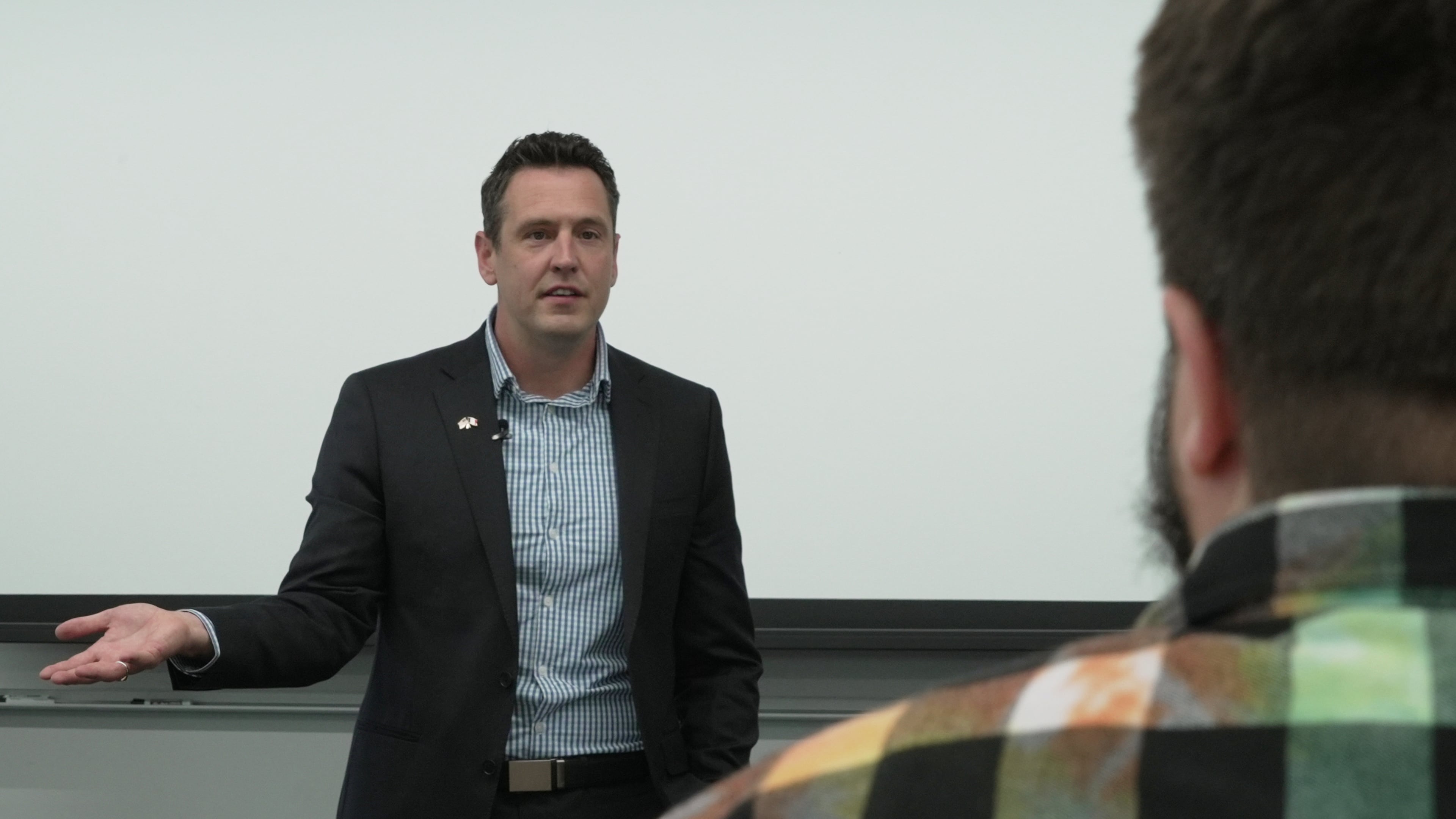 Zach Lahn, Republican candidate for Iowa governor, speaks to an environmental studies class at Drake University on Wednesday, May 6, 2026 in Des Moines, Iowa. (AP Photo/Brittany Peterson)