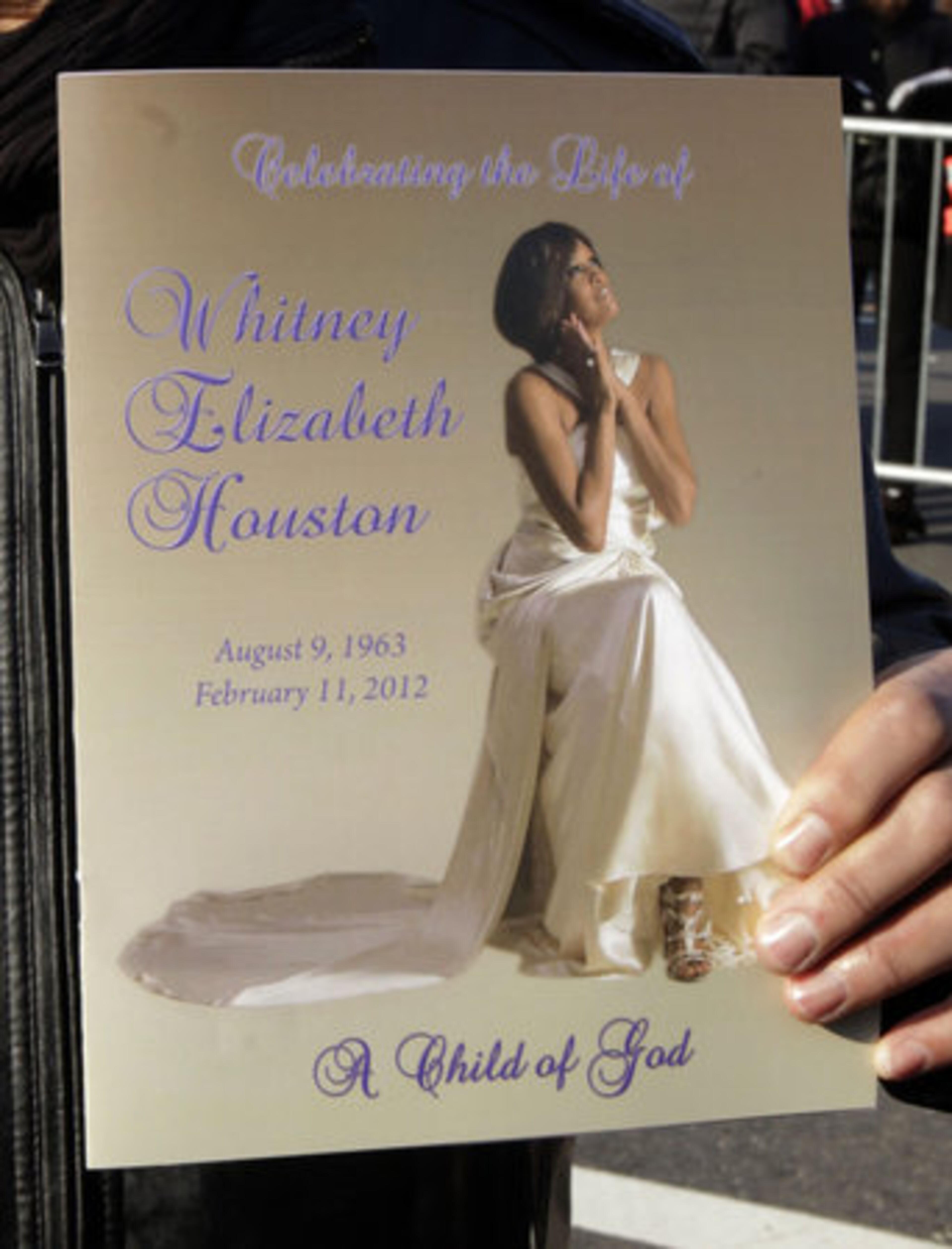 A program from the funeral service for singer Whitney Houston is displayed outside the New Hope Baptist Church in Newark, N.J. on Saturday, Feb. 18, 2012.