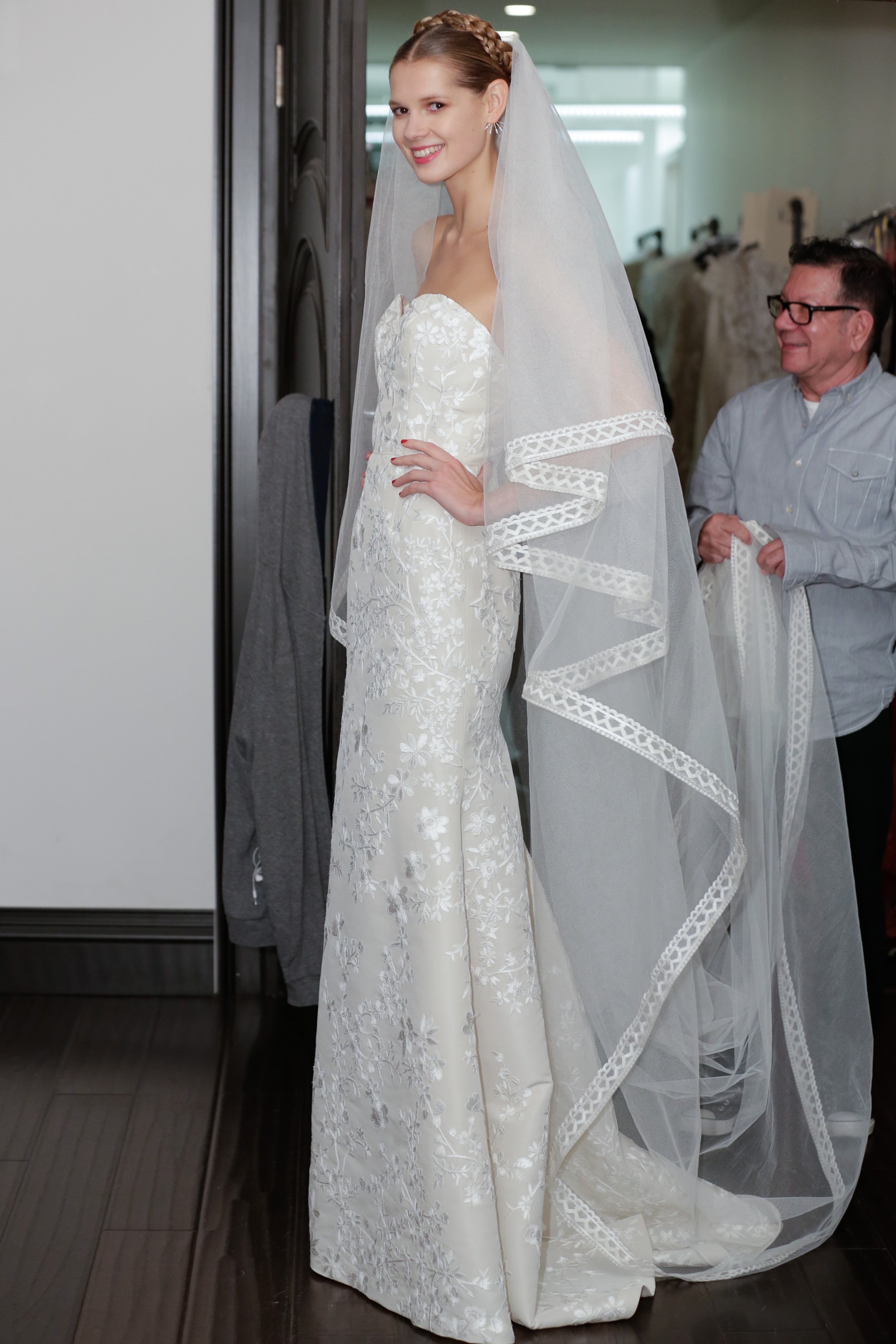 A model receives last-minute preparations before the Naeem Khan Fall/Winter 2014 Bridal collection presentation and reception on Oct. 12, 2013, in New York City.