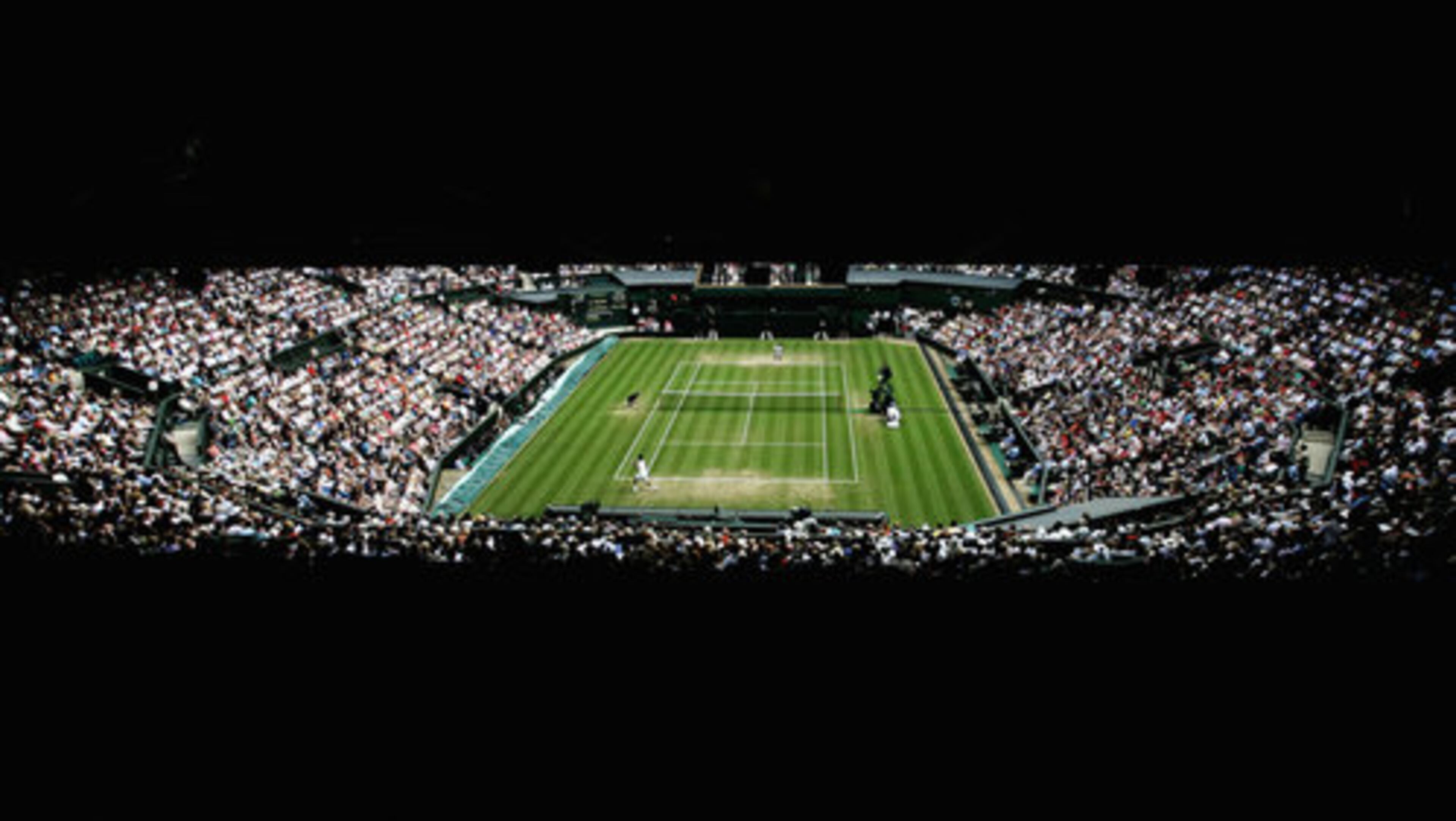 On Friday in London patrons watch Roger Federer in round three of his men's singles match against Marc Gicquel of France at the Wimbledon Lawn Tennis Championships.