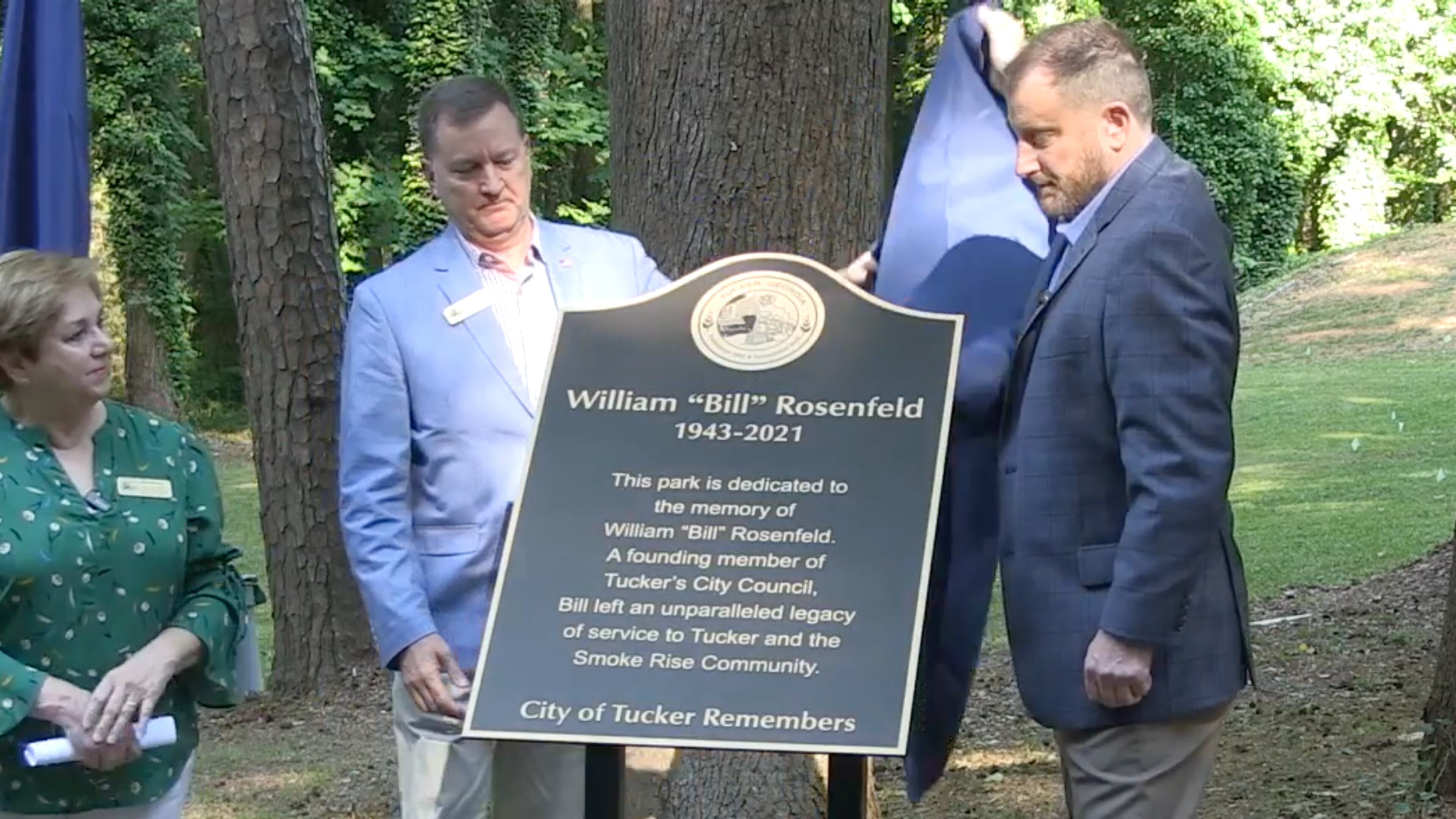 Councilwoman Pat Soltys (left), Mayor Frank Auman (center) and Corey Rosenfeld (right) unveiled a plaque in the newly named William "Bill" Rosenfeld Park on May 28.