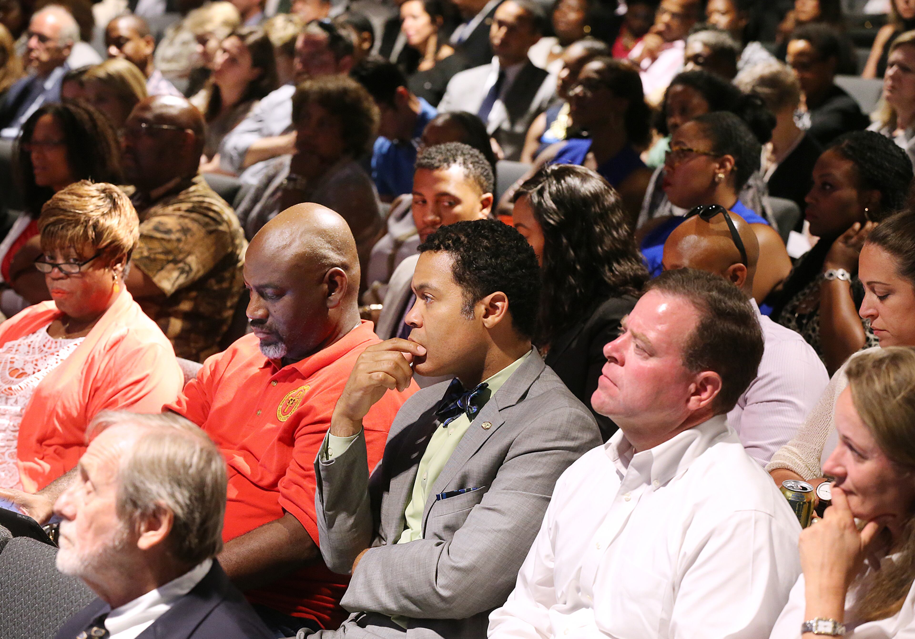 Audience members listen while panelists hold an open dialogue on "Communities in Crisis" at the Impact United Methodist Church on Wednesday, July 13, 2016, in Atlanta. Curtis Compton /ccompton@ajc.com