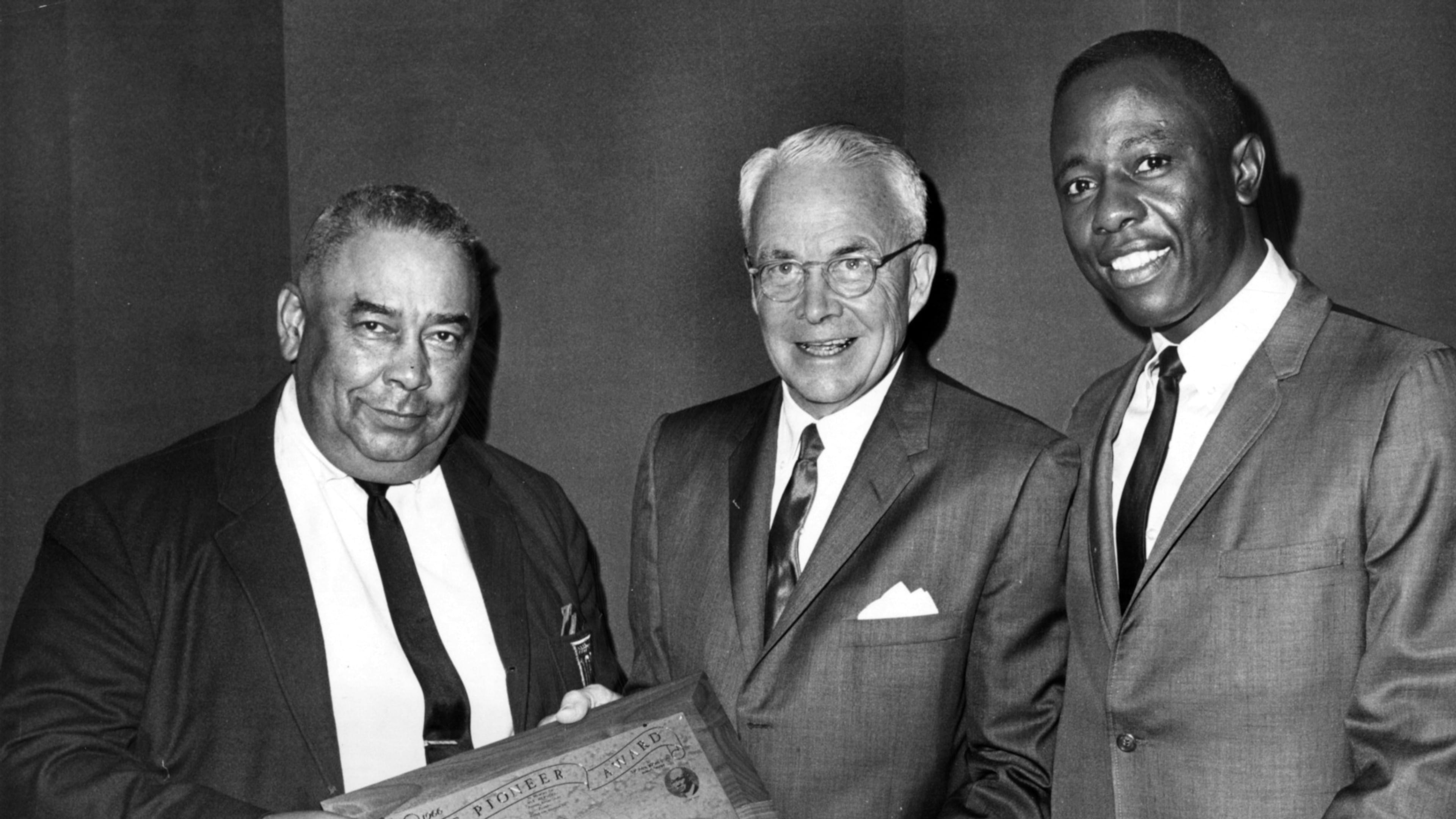 Mayor Ivan Allen Jr. (center) is presented with the Pioneer Award by the 100% Wrong Club and its president, Al Thompson (left), as Braves great Hank Aaron looks on. Allen ran for mayor of Atlanta on the promise he would bring big league sports to the city, guest columnist Bob Hope writes. (Bob Dendy/AJC 1967)