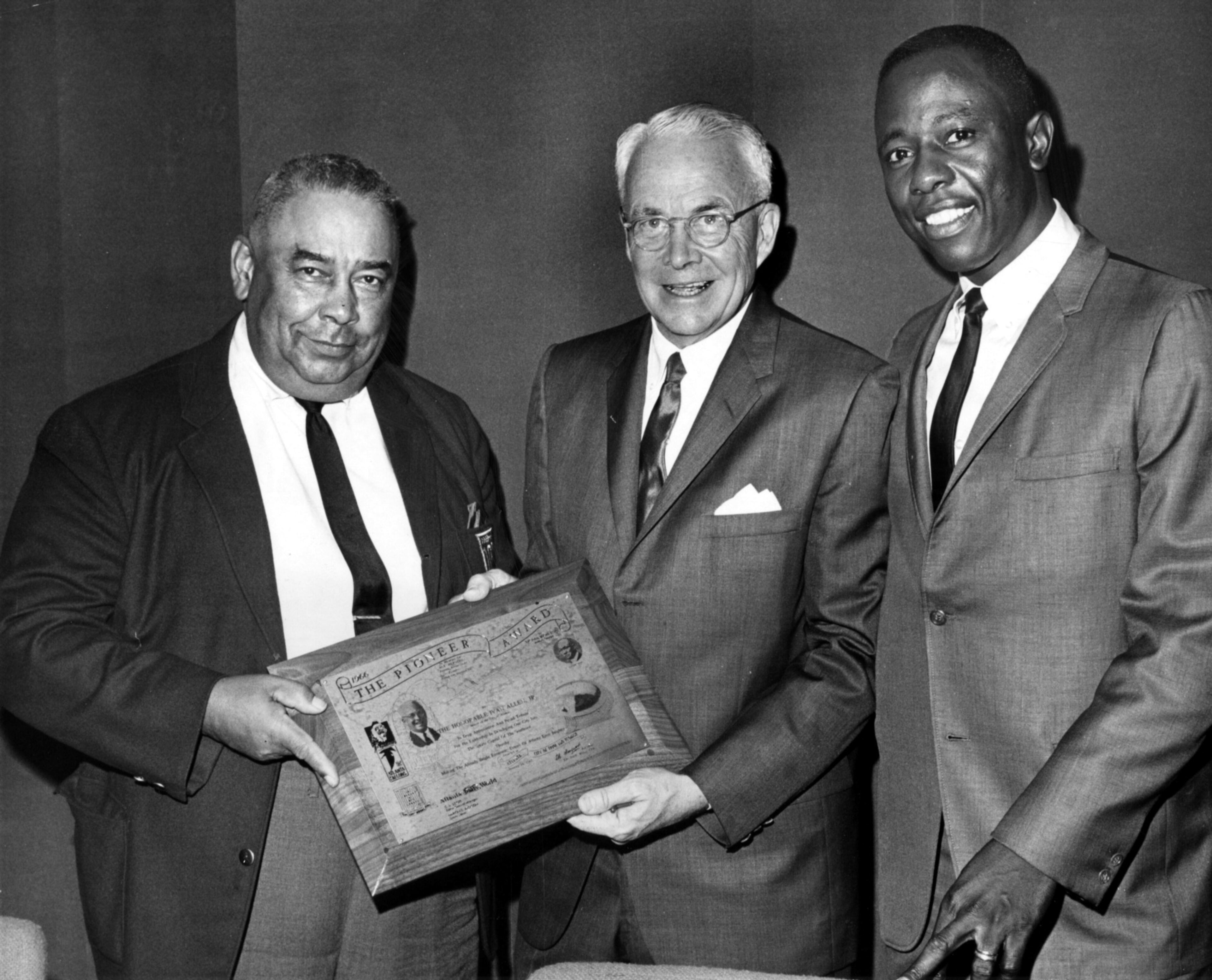 1967 -- Mayor Ivan Allen Jr. was presented with the Pioneer Award by the 100 Per Cent Wrong Club in tribute of his outstanding work in sports. Club president Al Thompson (left) and the Braves Hank Aaron flank the mayor. Aaron, who won the 1967 National League home run championship, was the guest of honor at the club's opening-season meeting at the Stadium Club.