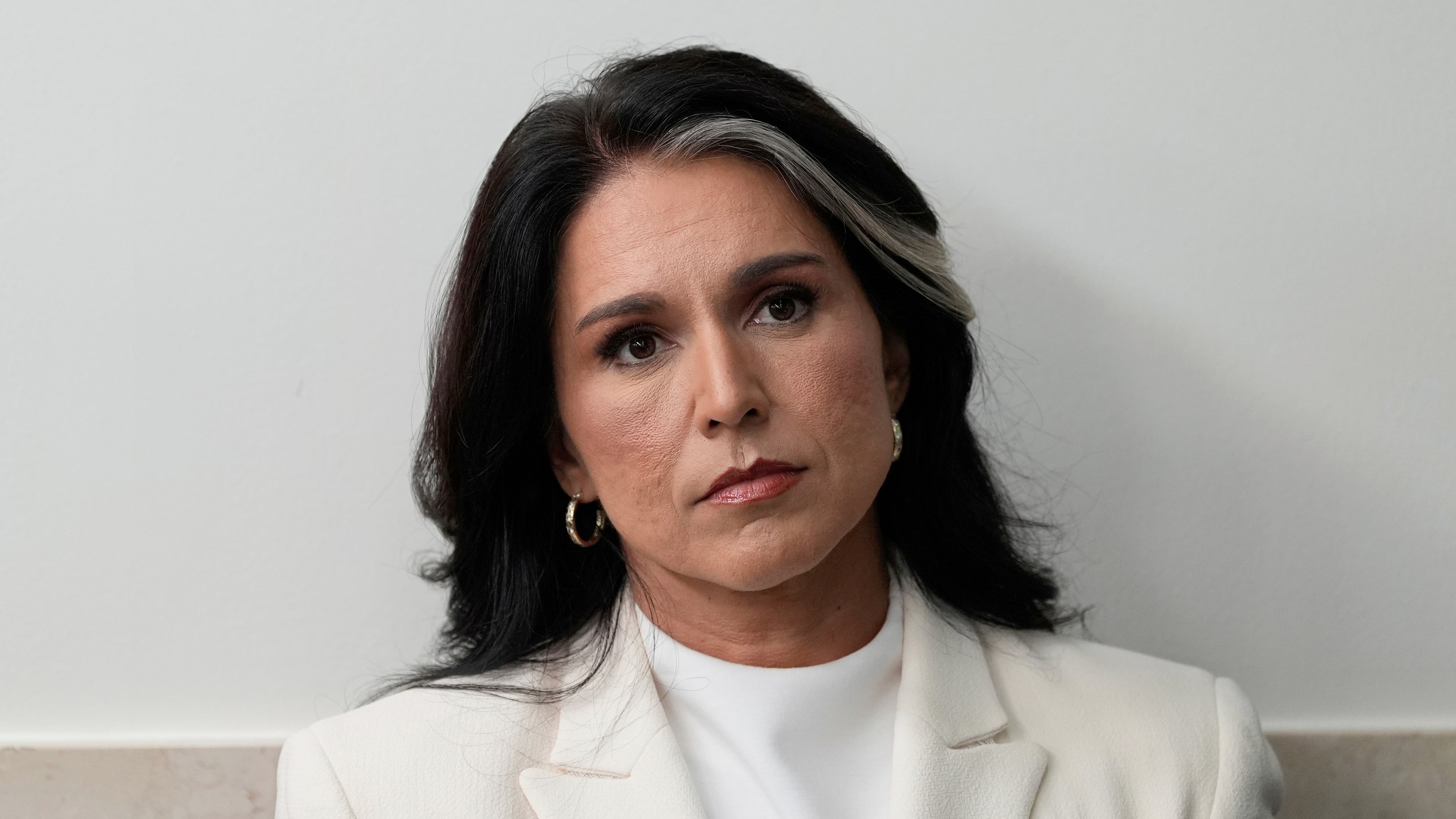 FILE - Director of National Intelligence Tulsi Gabbard sits in the James Brady Press Briefing Room at the White House, July 23, 2025, in Washington. (AP Photo/Alex Brandon, File)
