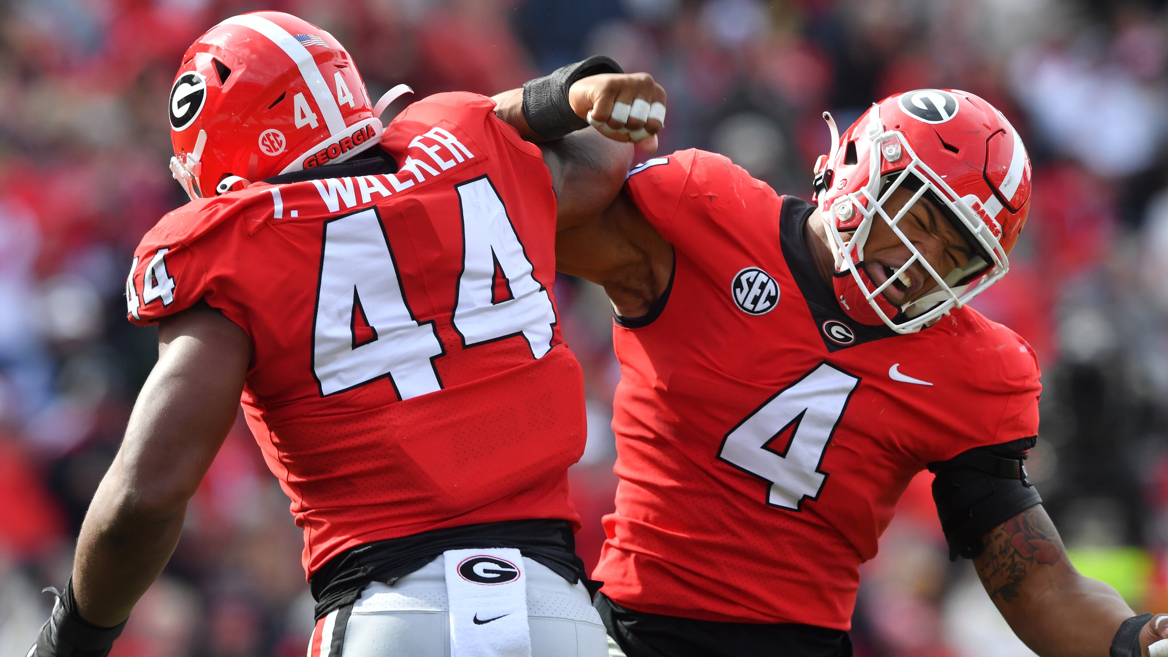 Georgia defensive lineman Travon Walker (44) celebrates with linebacker Nolan Smith (4) after he sacked Missouri quarterback Tyler Macon in the second half at Sanford Stadium on Saturday, November 6, 2021. Georgia won 43-6 over Missouri. (Hyosub Shin / Hyosub.Shin@ajc.com)