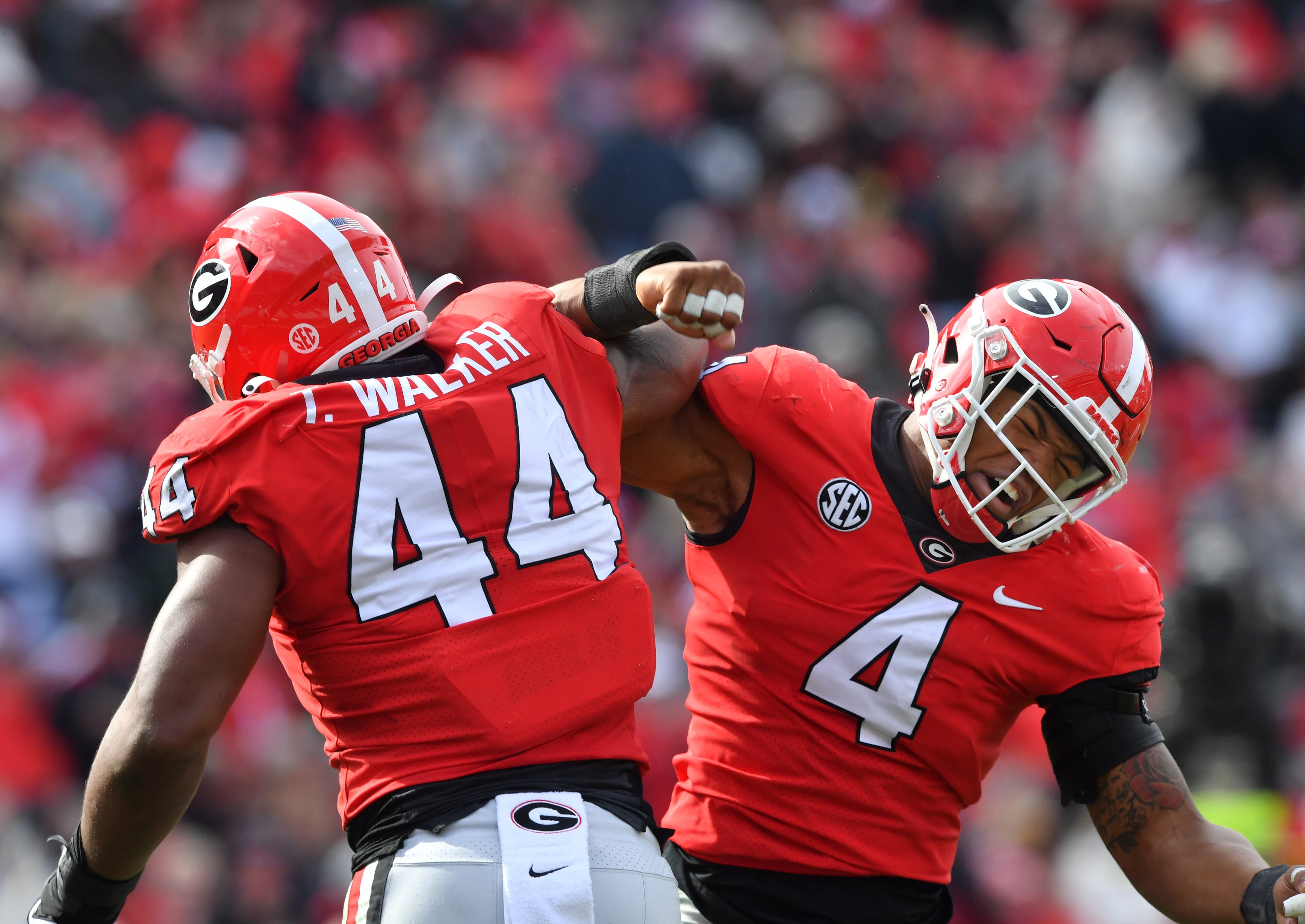 Georgia's defensive lineman Travon Walker (44) celebrates with Georgia's linebacker Nolan Smith (4) after he sacked Missouri's quarterback Tyler Macon in the second half during a NCAA football game at Sanford Stadium in Athens on Saturday, November 6, 2021. Georgia won 43-6 over Missouri. (Hyosub Shin / Hyosub.Shin@ajc.com)