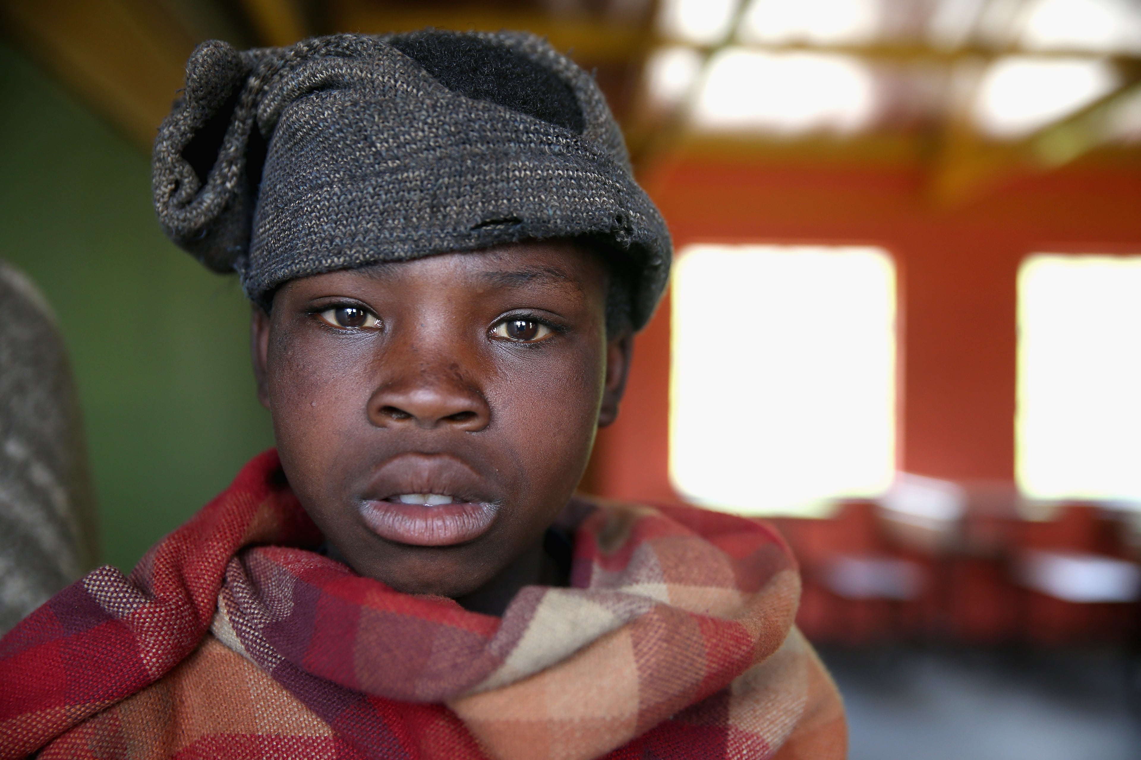 Herd boys in class during a visit to a herd boy night school constructed by Sentebale on December 8, 2014 in Mokhotlong, Lesotho. Prince Harry was visiting Lesotho to see the work of his charity Sentebale. Sentebale provides healthcare and education to vulnerable children in Lesotho, Southern Africa. The particular theme of his visit was to check on the progress of the Mamohato Childrens Centre which will provide vital support to children affected by HIV. Prince Harry founded Sentebale (which means Forget Me Not in Sesotho) with Prince Seeiso in 2006. (Photo by Chris Jackson/Getty Images for Sentebale)
