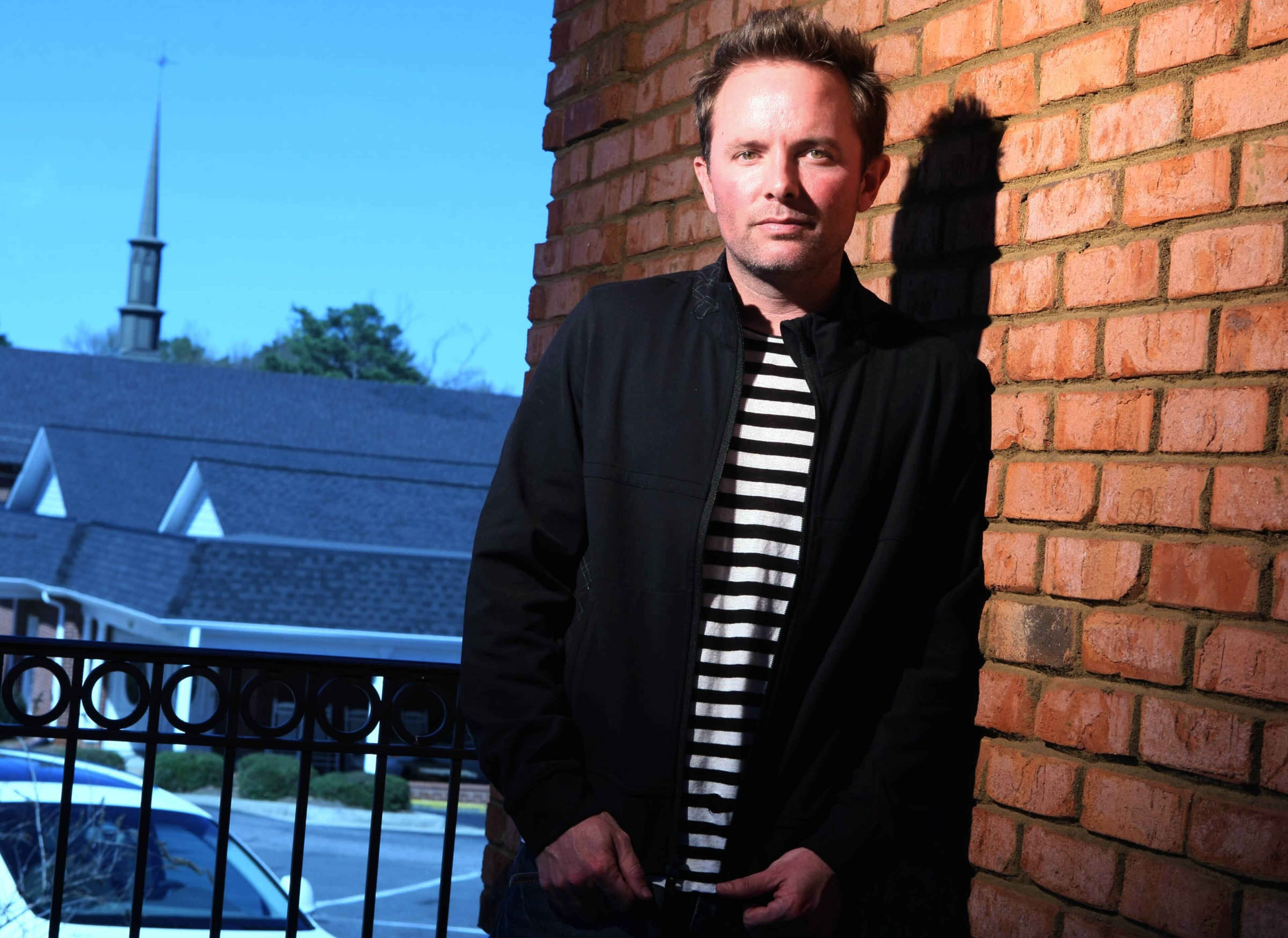 090320 Alpharetta, GA -- Christian artist and recent Atlanta transplant Chris Tomlin is shown at the office of Passion City Church Friday afternoon in Alpharetta, Ga., March 20, 2009. Tomlin joined evangelist Louie Giglio in late 2008 in their efforts to plant a church in the metro Atlanta area called; Passion City Church. Tomlin is the most sung Christian artist in the country. In the background is church neighbor, Alpharetta First United Methodist. JASON GETZ / jgetz@ajc.com