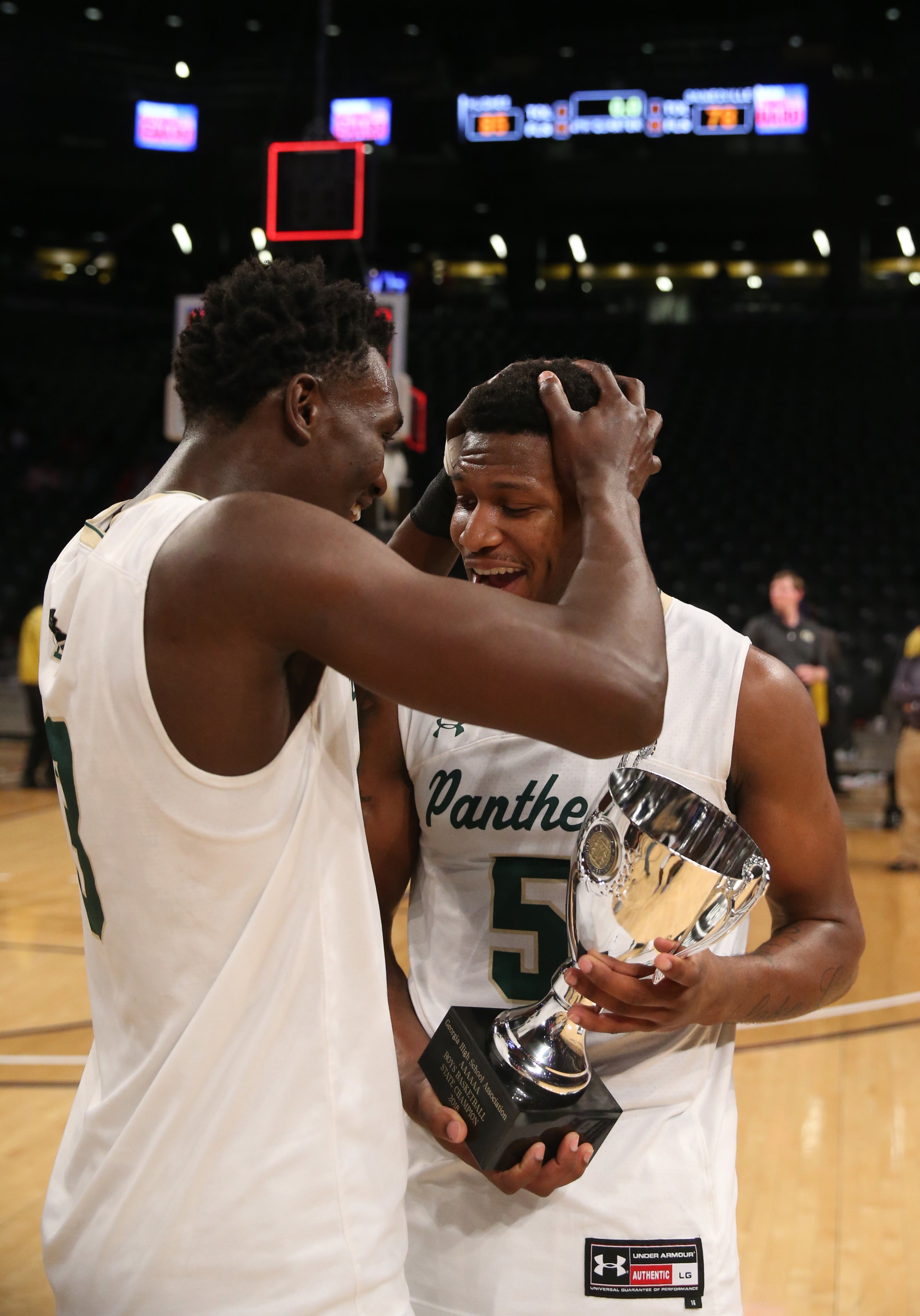 March 9, 2018 - Atlanta, Ga: Hughes center Papa Samba (3) and forward Tyler Smith (5) celebrate after they defeated Gainesville during the GHSA Class AAAAAA Boys State Championship at McCamish Pavilion Friday, March 9, 2018, in Atlanta. Hughes won 85-78. PHOTO / JASON GETZ