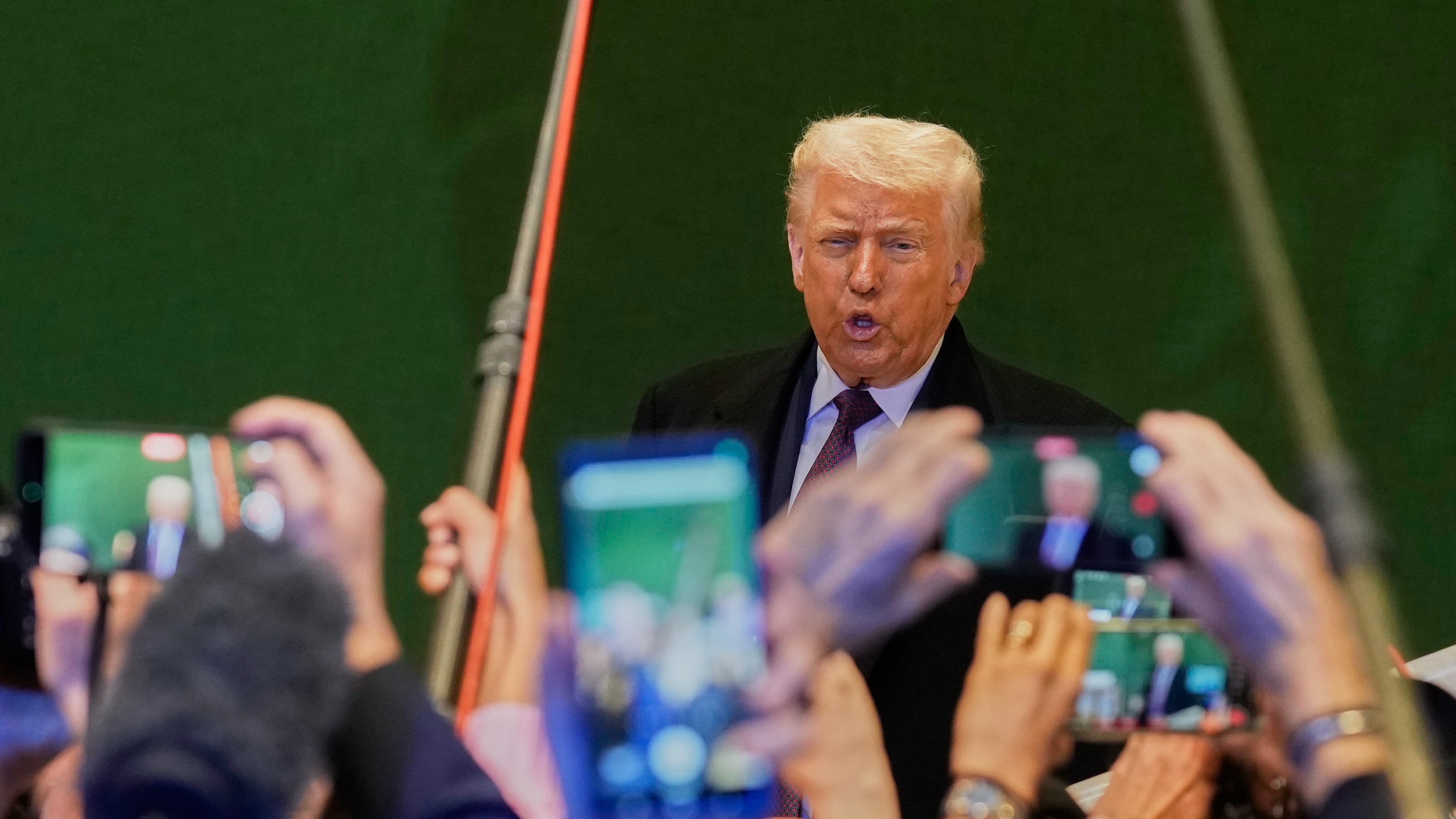 US President Donald Trump talks to media during the Annual Meeting of the World Economic Forum in Davos, Switzerland, Thursday, Jan. 22, 2026. (AP Photo/Markus Schreiber)