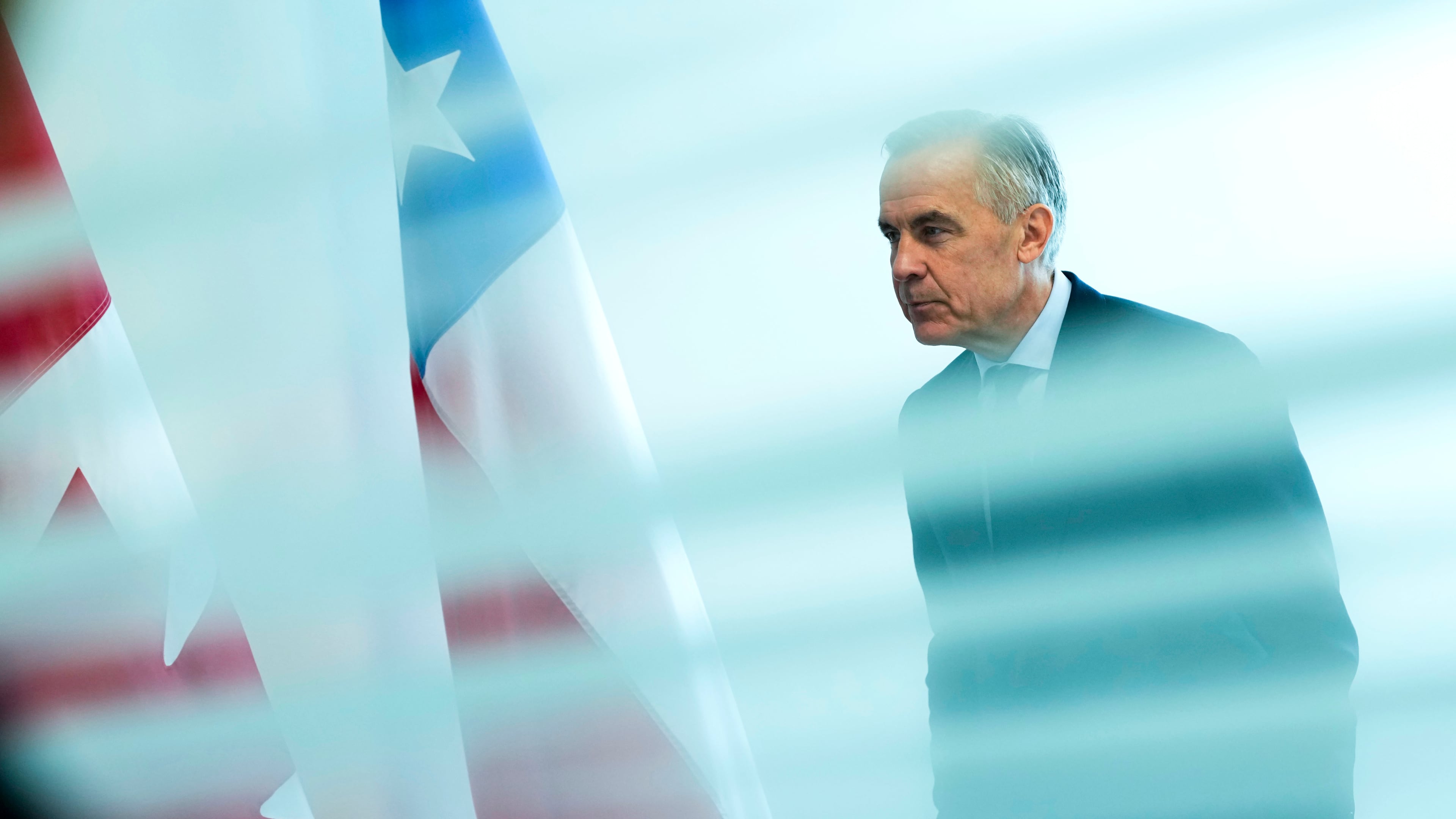 Canada Prime Minister Mark Carney is seen from behind a glass pane as he waits to meet with President of Chile José Antonio Kast, not shown, on the sidelines of the United Nations General Assembly (UNGA) at the UN headquarters on Tuesday, Sept. 22, 2026. (Justin Tang/The Canadian Press via AP)
