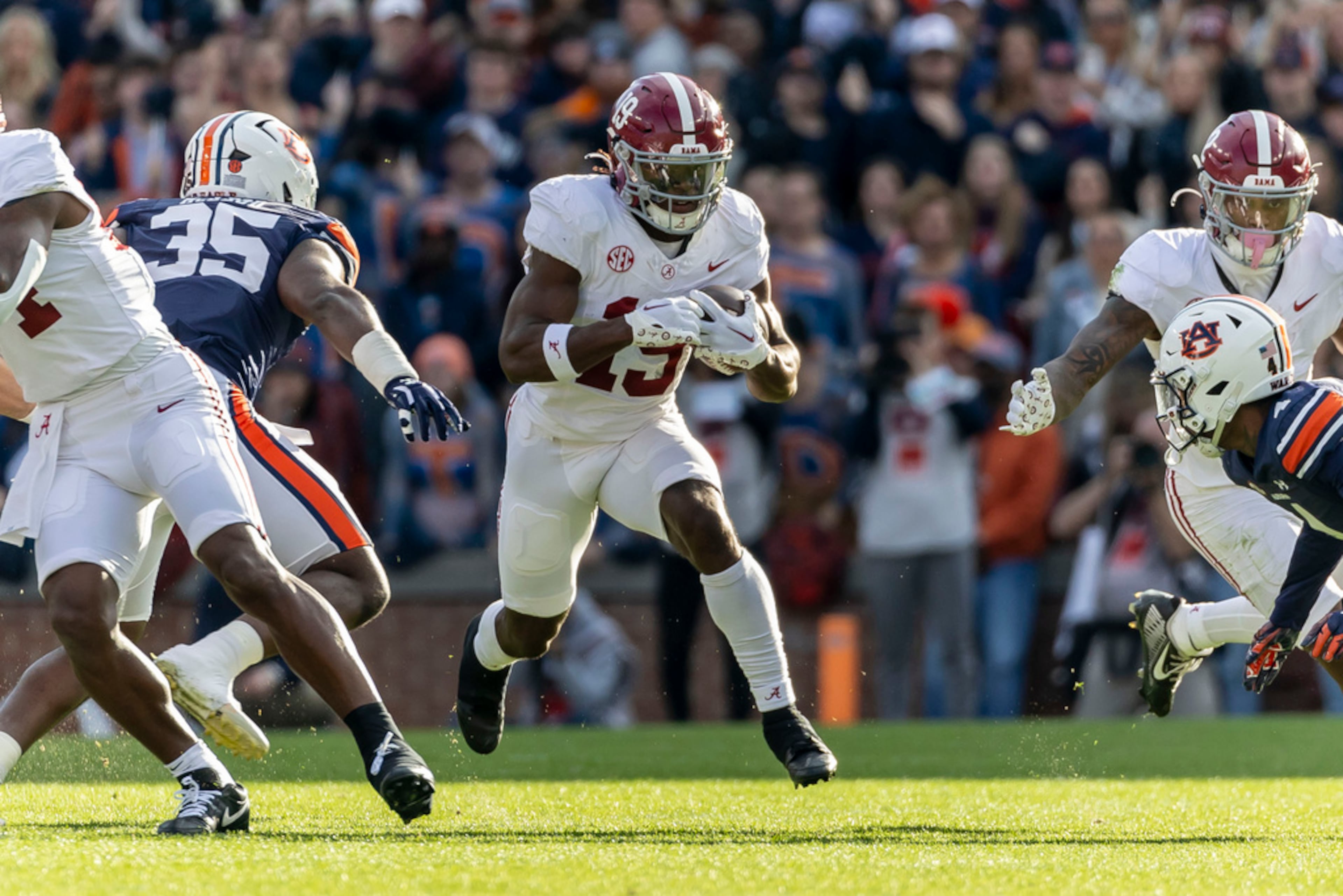 Alabama wide receiver Kendrick Law (19) runs after a catch against Auburn during the first half of an NCAA college football game, Saturday, Nov. 25, 2023, in Auburn, Ala. (AP Photo/Vasha Hunt)