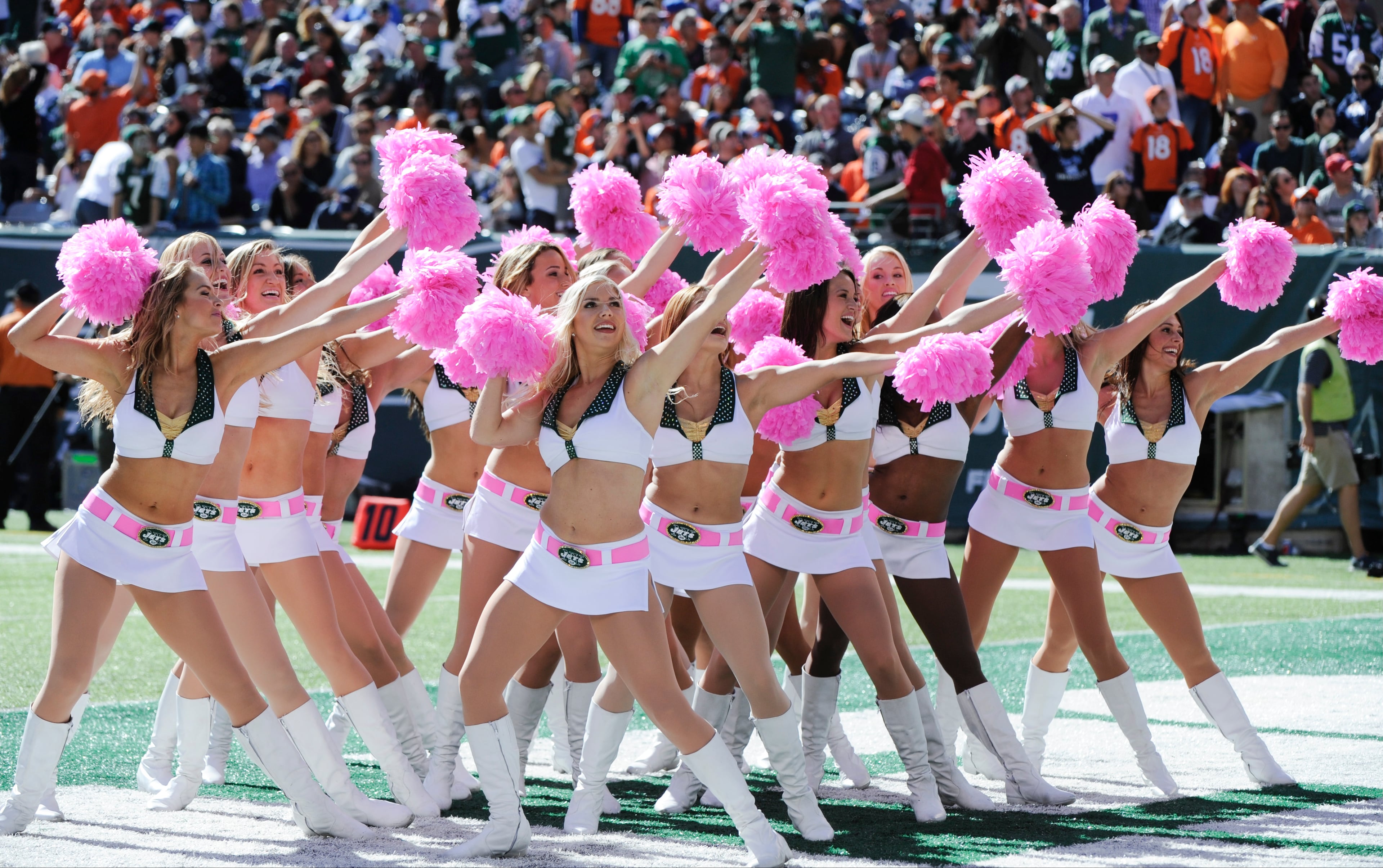 New York Jets cheerleaders perform during the second quarter against the Denver Broncos during an NFL football game, Sunday, Oct. 12, 2014, in East Rutherford, N.J. (AP Photo/Bill Kostroun)
