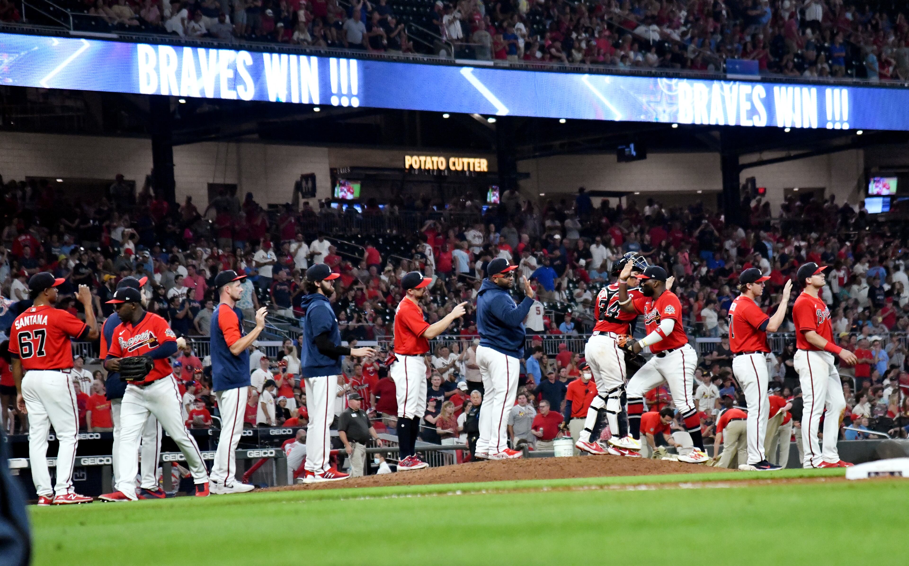 Braves players celebrate their 9-1 victory over St. Louis Cardinals at Truist Park on Friday, June 18, 2021. (Hyosub Shin / Hyosub.Shin@ajc.com)