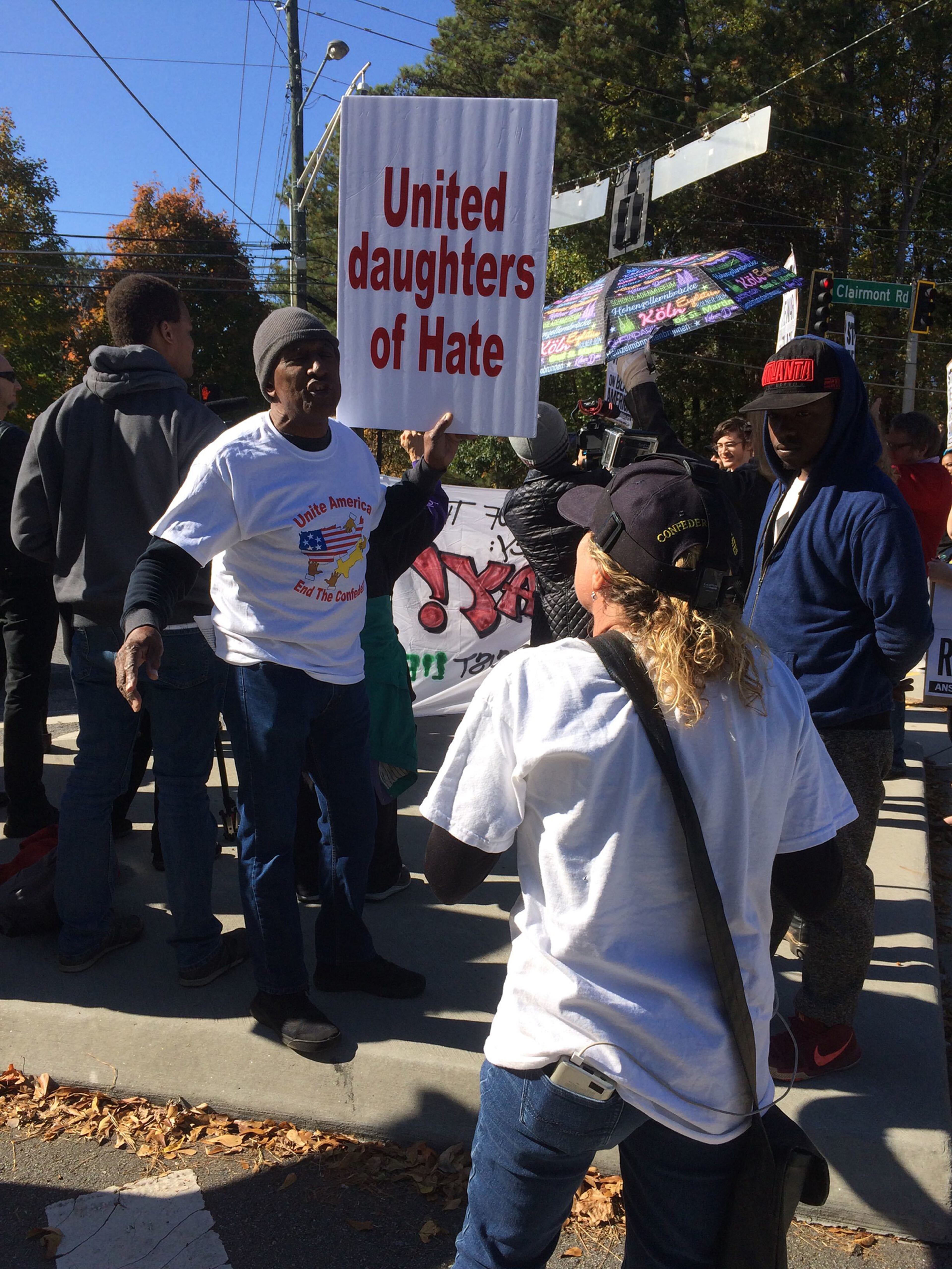 Lone counterprotester Jenna Bernstein (foreground) gets in a shouting match with Richard Rose, president of the NAACP's Atlanta branch, at a rally against the United Daughters of the Confederacy held Saturday, November 9, 2019, in Atlanta. (Photo: Michael E. Kanell/AJC)