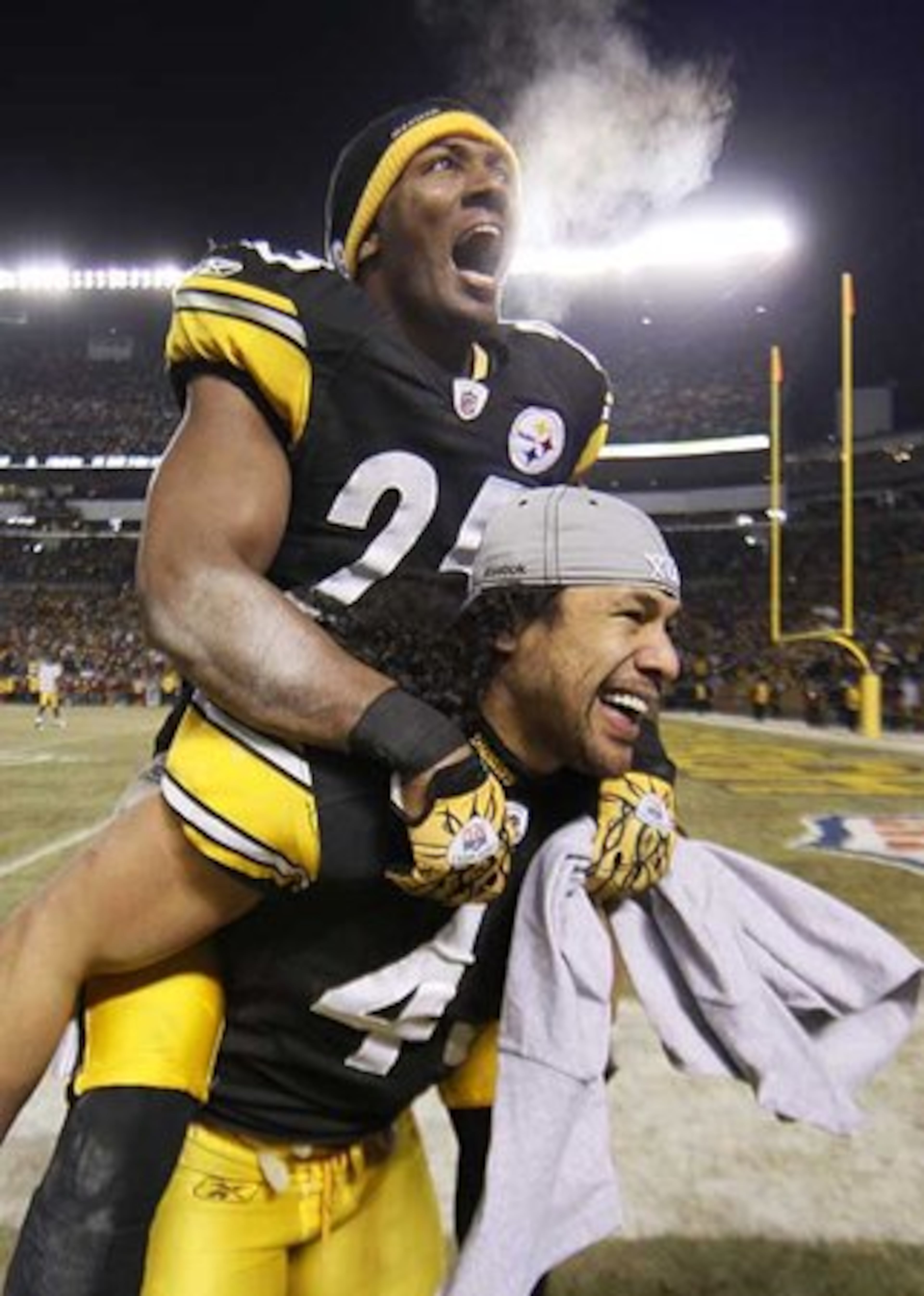 Steelers safeties Ryan Clark, top, and Troy Polamalu celebrate after a 24-19 win over the New York Jets in the AFC Championship.