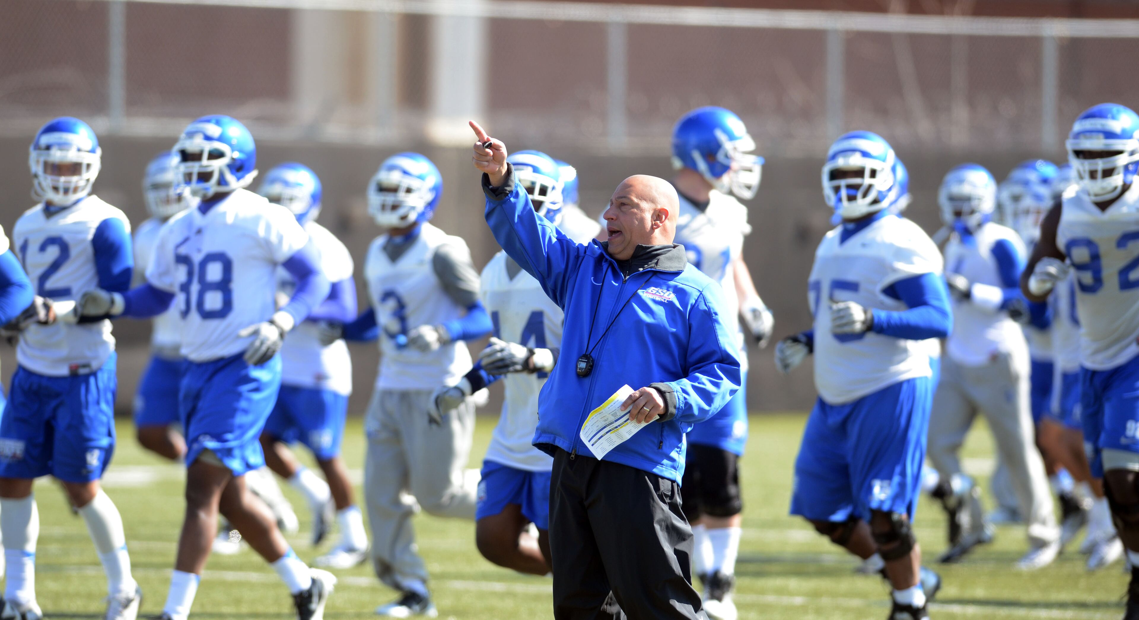 Coach Trent Miles directs the team to another segment in Weds practice. Georgia State opened its first spring practice under new head coach Trent Miles at the GSU Practice Complex in downtown Atlanta Wednesday, March 27, 2013.