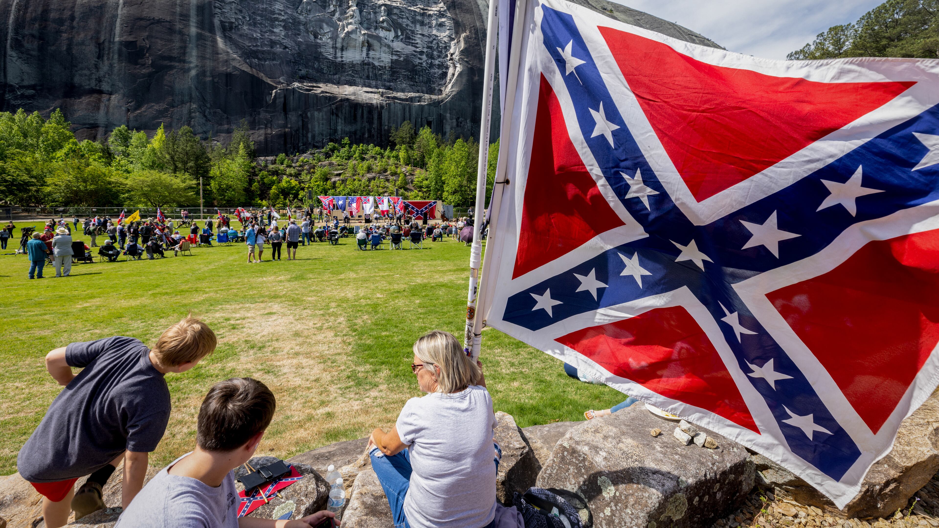 Participants wait for the speakers to start during the Confederate Memorial Day celebration in Stone Mountain Park Saturday, April 29, 23. (Steve Schaefer/AJC)