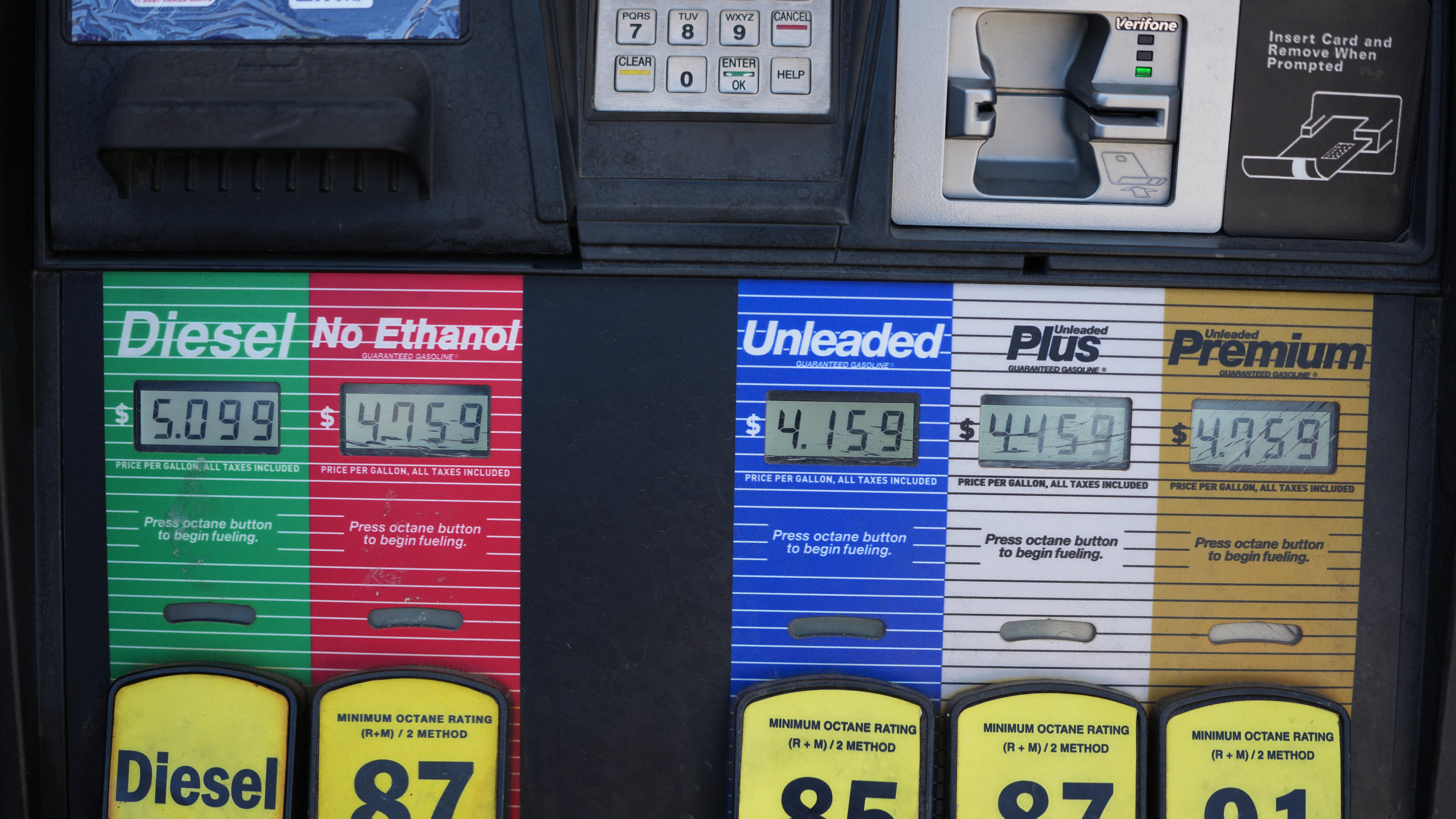 The per-gallon price is displayed electronically over the various grades of fuel available from a pump at a QT gasoline station Thursday, July 30, 2026, in Greenwood Village, Colo. (AP Photo/David Zalubowski)