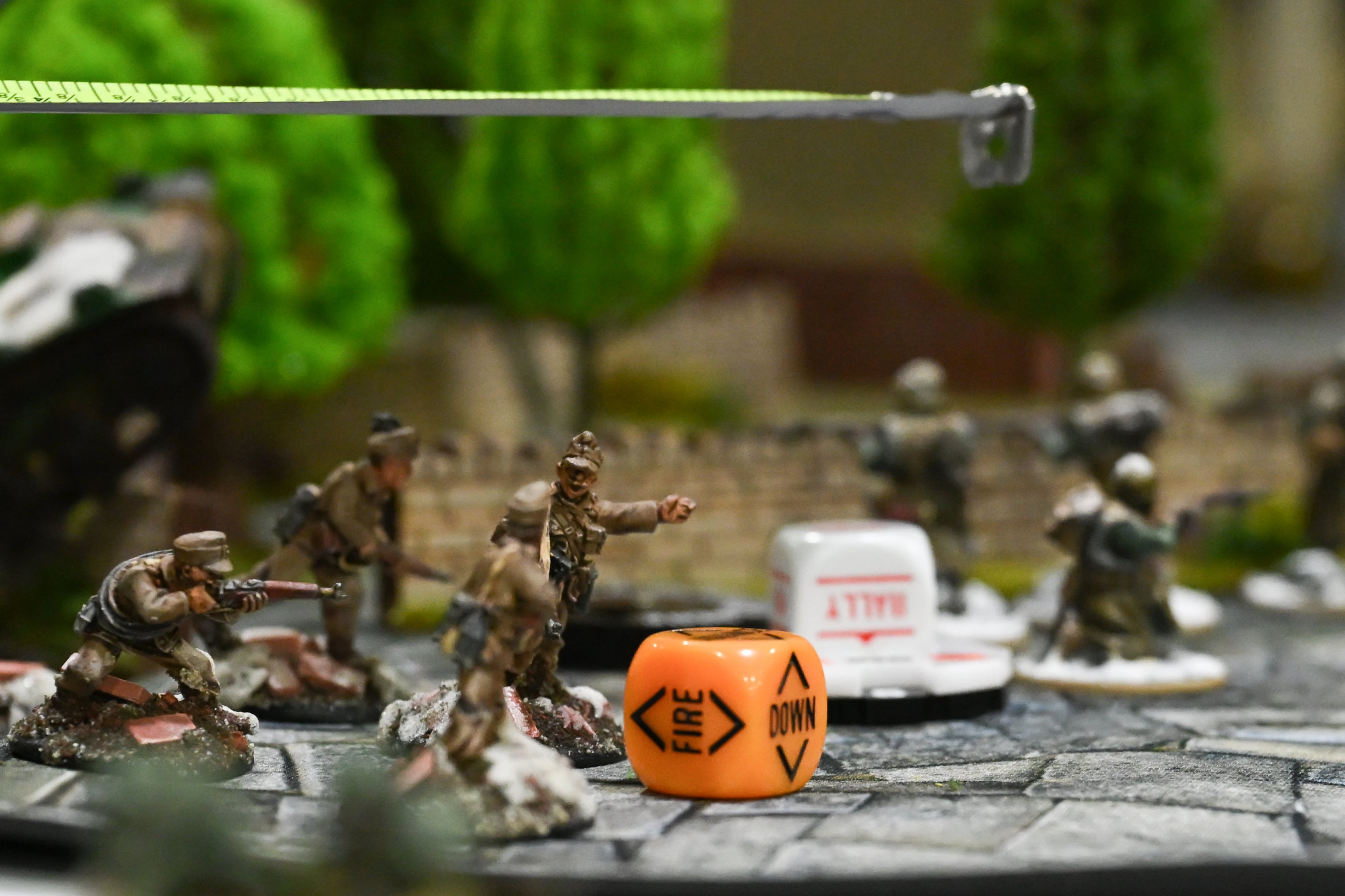 A player measures the distance for a miniature to move in a tabletop game at MomoCon during MomoCon at the Georgia World Congress Center in Atlanta on Friday, May 22, 2026. (Tyler Sun for the AJC)