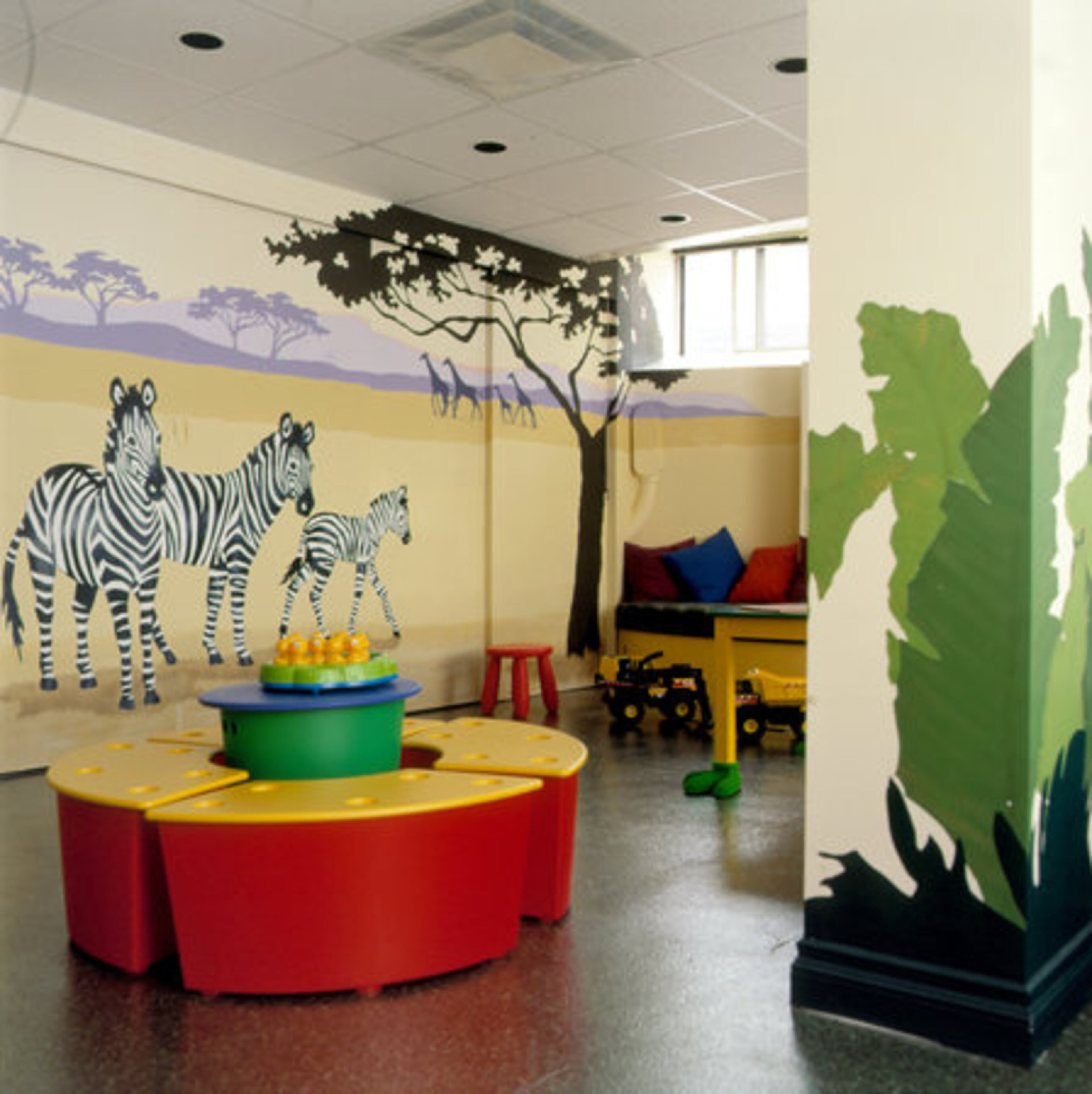 Ample storage, like these double-duty bench seats provide, is an essential element of a playroom, Singleton said. "For toddlers, it's important to have storage areas so they can learn to put things up," Singleton said.