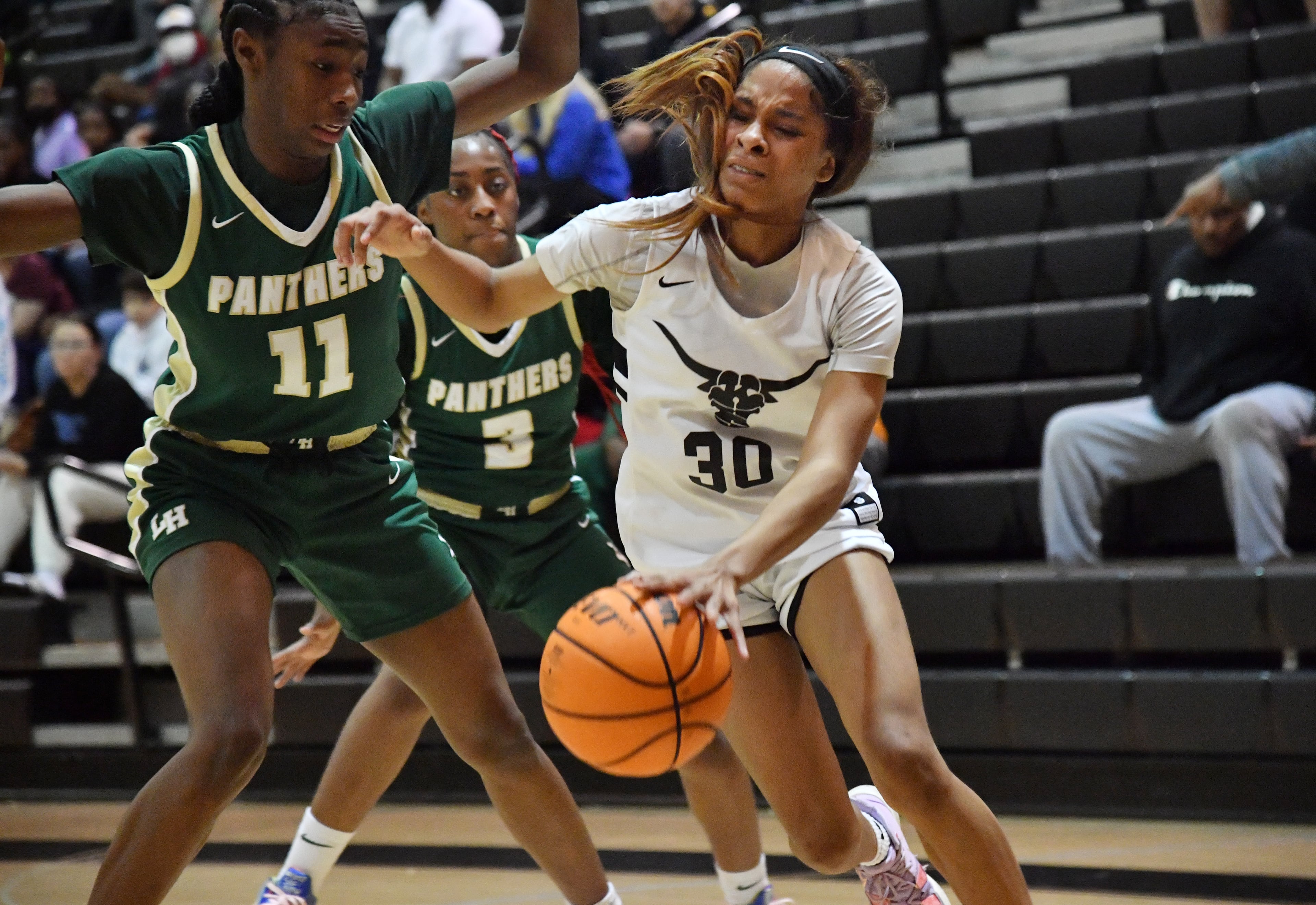 February 25, 2022 Marietta - Kell’s Crystal Henderson (30) drives against Langston Hughes' Sydney Smith (11) in the second half of 2022 Georgia Girls State Basketball playoffs at Kell high school in Marietta on Friday, February 25, 2022. Kell won 57-50 over Langston Hughes. (Hyosub Shin / Hyosub.Shin@ajc.com)