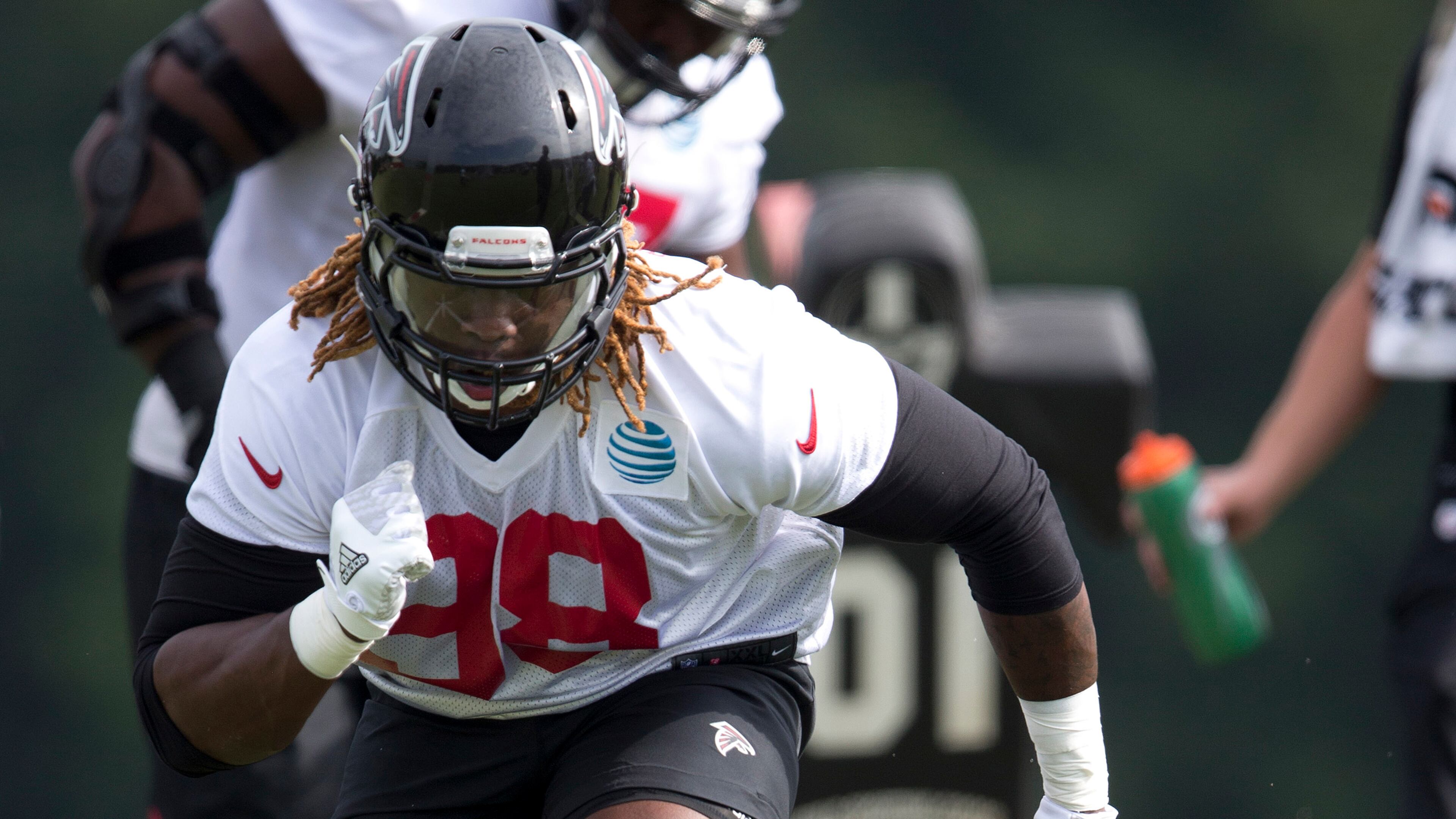 Atlanta Falcons defensive end Takkarist McKinley (98) runs drill during the team's NFL training camp football practice Friday, July 28, 2017, in Flowery Branch, Ga. (AP Photo/John Bazemore)