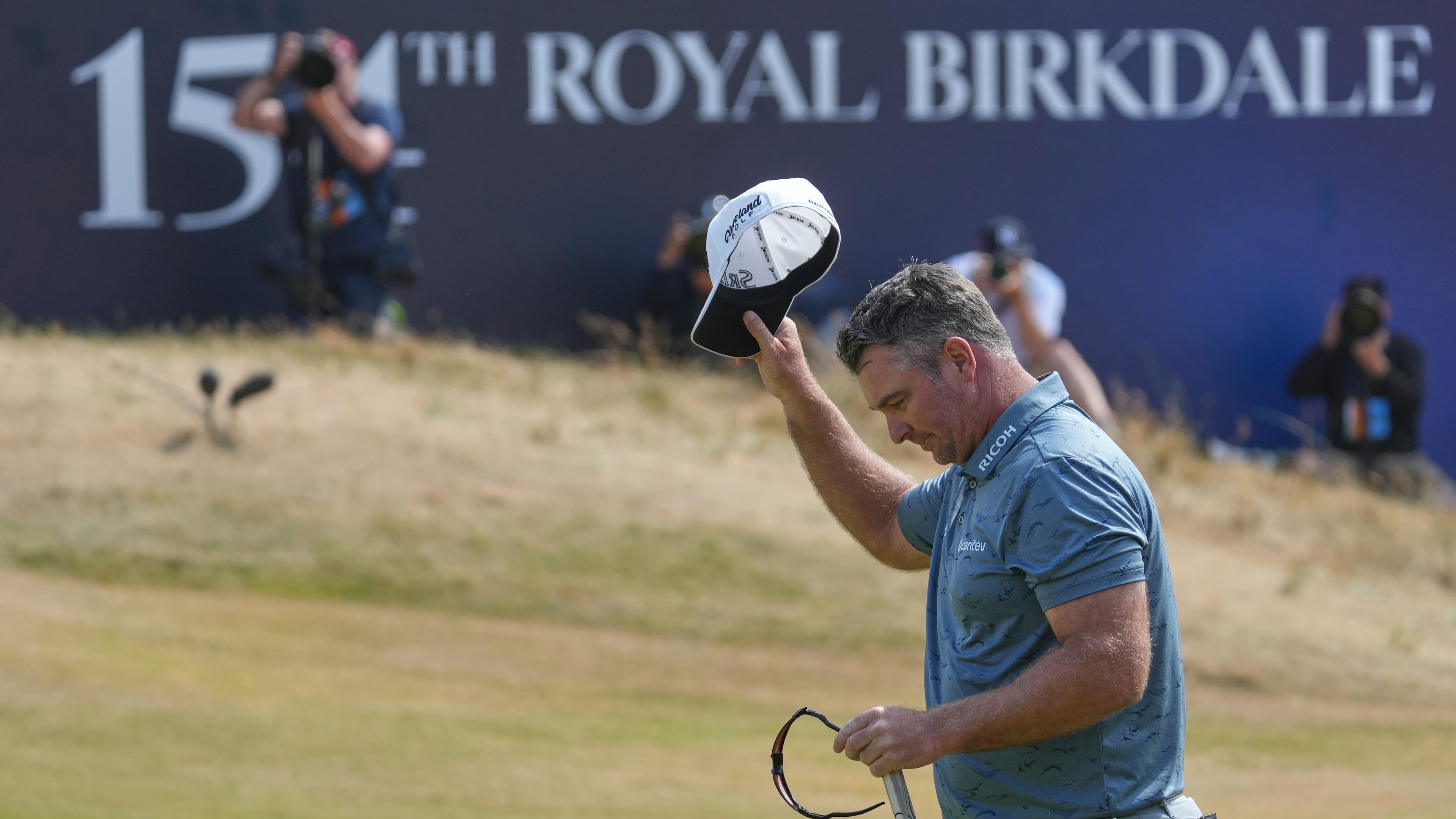 Ryan Fox of New Zealand acknowledges the crowd on the 188th green after completing his third round during the third day of the British Open Golf championships at Royal Birkdale golf club, in Southport, England, Saturday, July 18, 2026. (AP Photo/Jon Super)