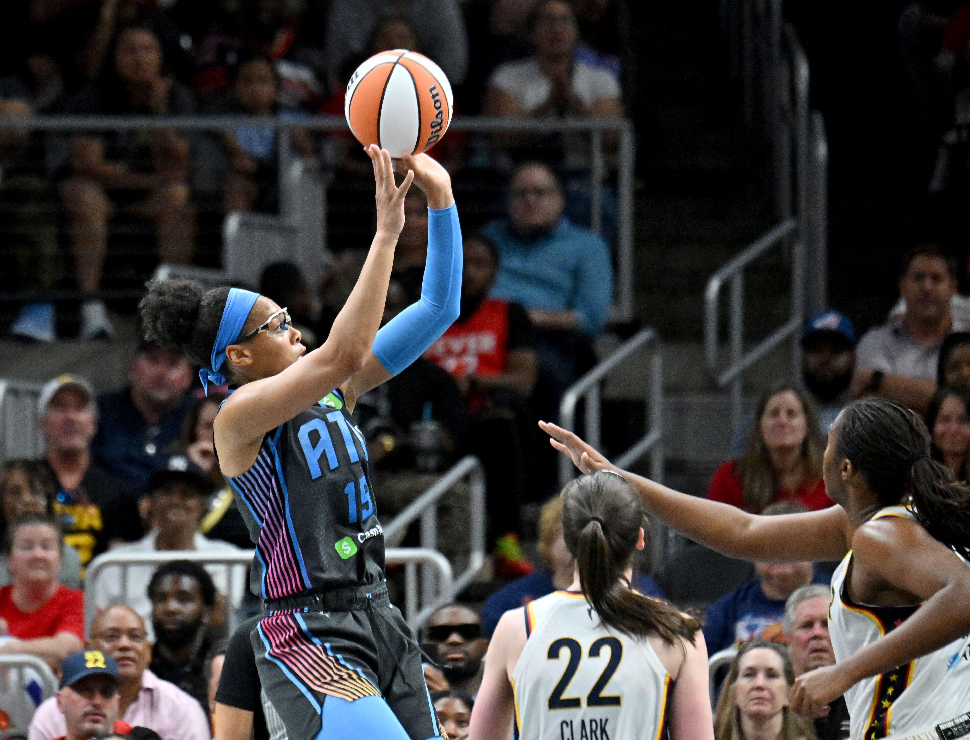 Atlanta Dream guard Allisha Gray (15) gets off a shot during the second half in Atlanta Dream’s home opener at State Farm Arena, Thursday, May 22, 2025, in Atlanta. Indiana Fever won 81-76 over Atlanta Dream. (Hyosub Shin / AJC)