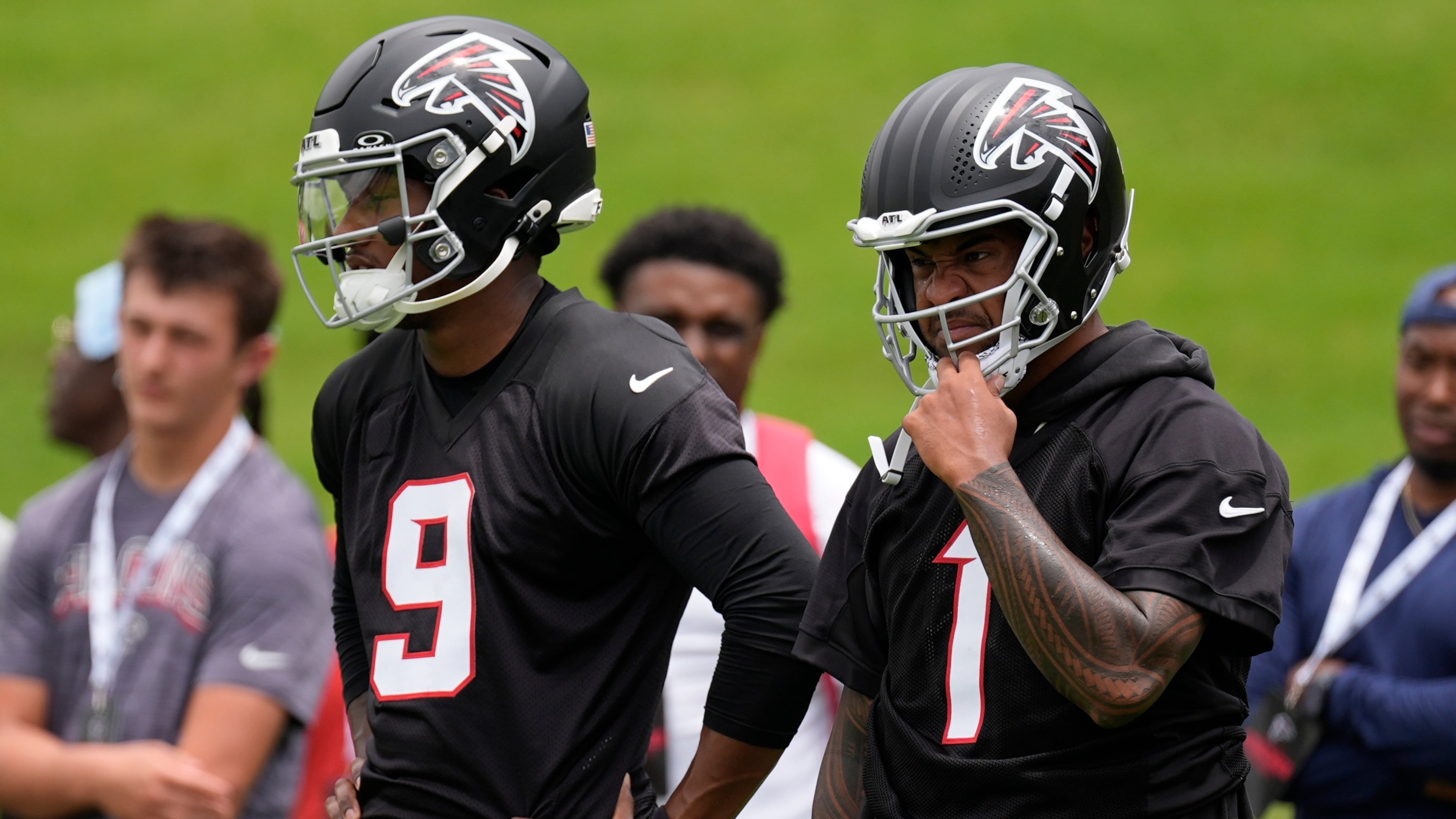 Falcons quarterbacks Michael Penix Jr. (left) and Tua Tagovailoa stand together at practice Wednesday, May 27, 2026, in Flowery Branch, Ga. (Mike Stewart/AP)