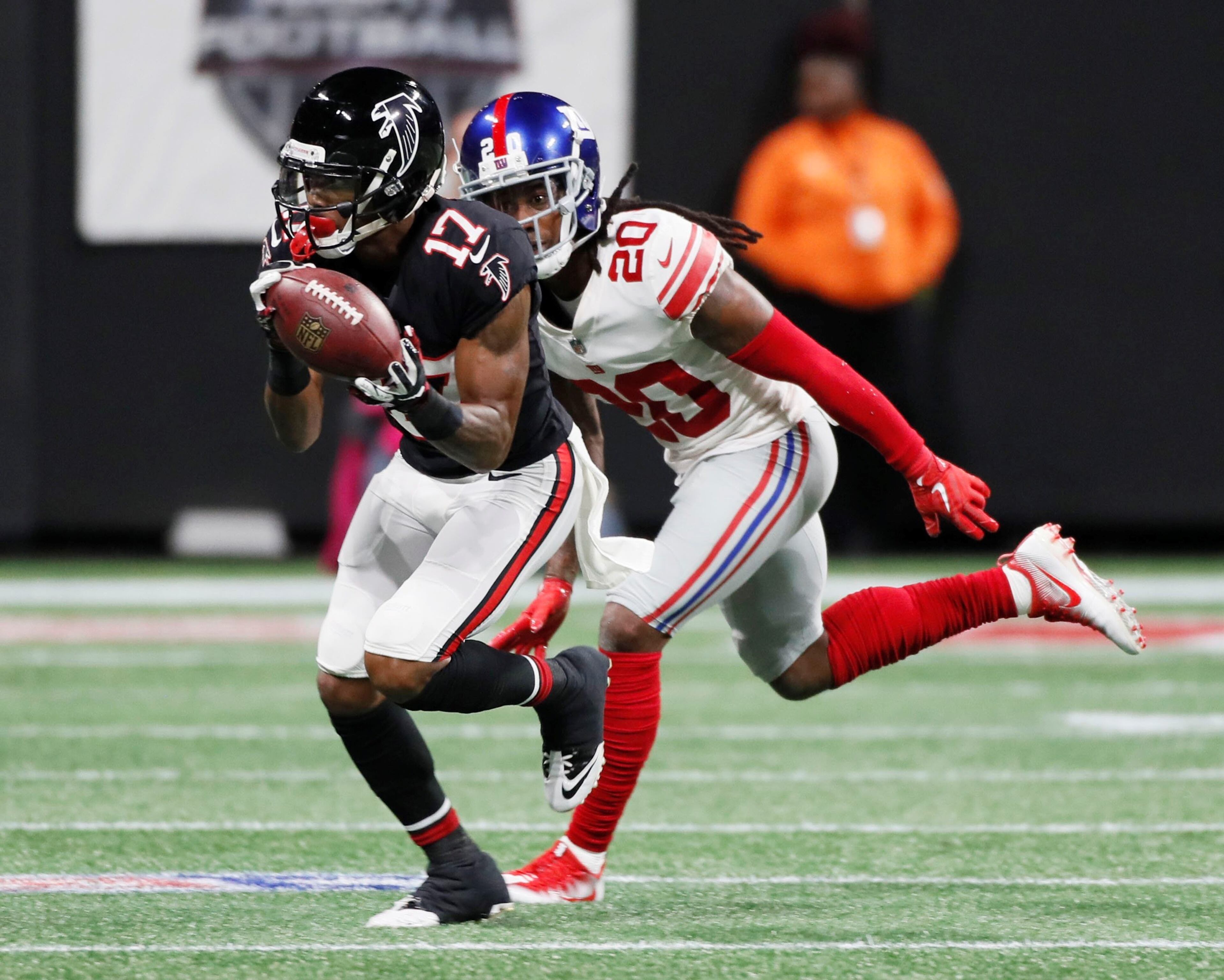 10/22/18 - Atlanta - Atlanta Falcons wide receiver Marvin Hall (17) makes this catch for a first down in the second half in front of defender New York Giants cornerback Janoris Jenkins (20). The Atlanta Falcons played the New York Giants in an NFL football game Monday, October 22, 2018, at Mercedes-Benz Stadium in Atlanta, GA. BOB ANDRES / BANDRES@AJC.COM
