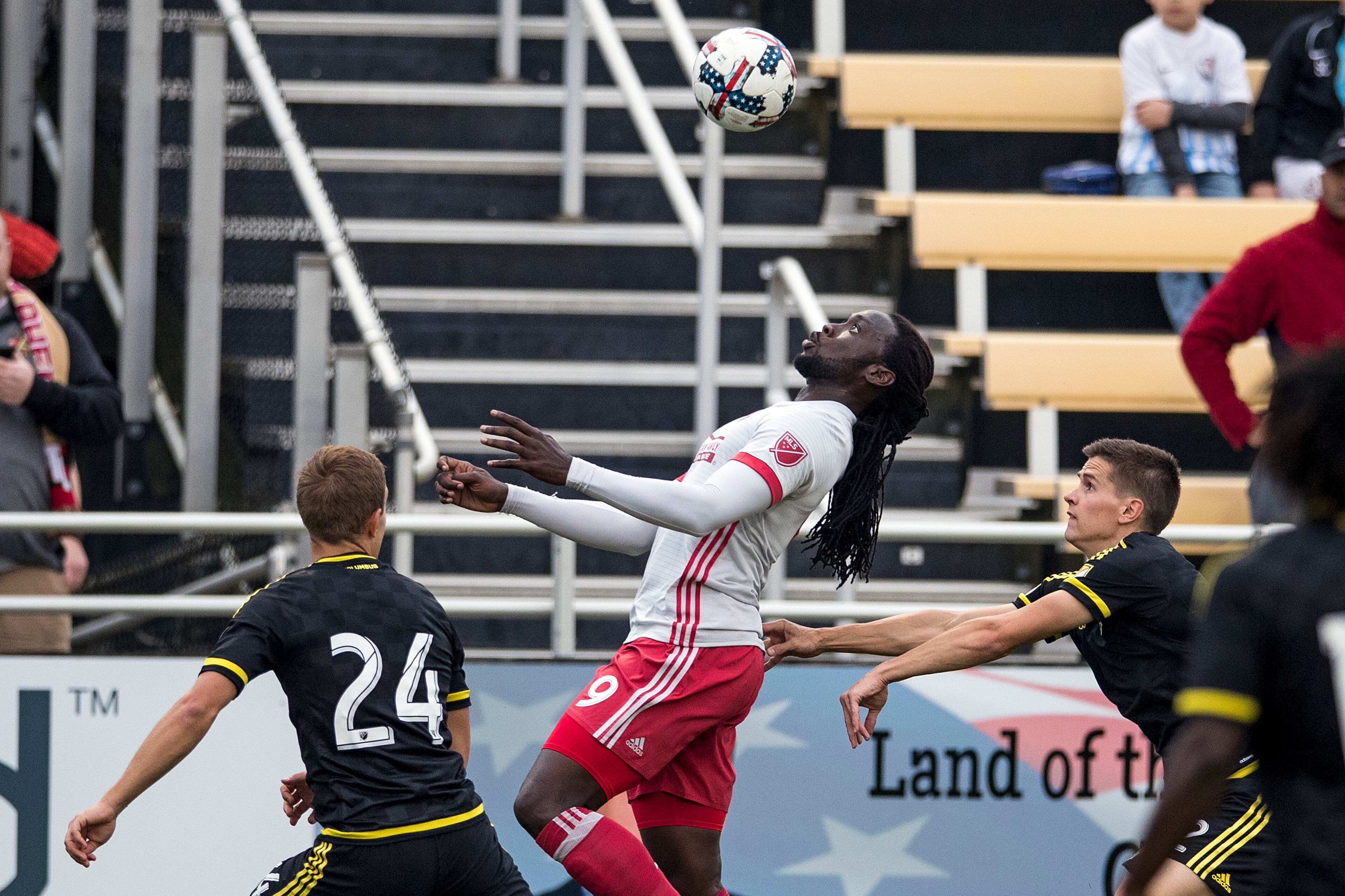 Charleston, South Carolina - February 18, 2017:
Atlanta's Kenwyne Jones
Kenwyne Jones (#9) attempts to control the ball out of the air despite the best efforts of a pair of Columbus Crew defenders on Saturday, Feb. 18, 2017 in Charleston. (Photo by Alex Holt)