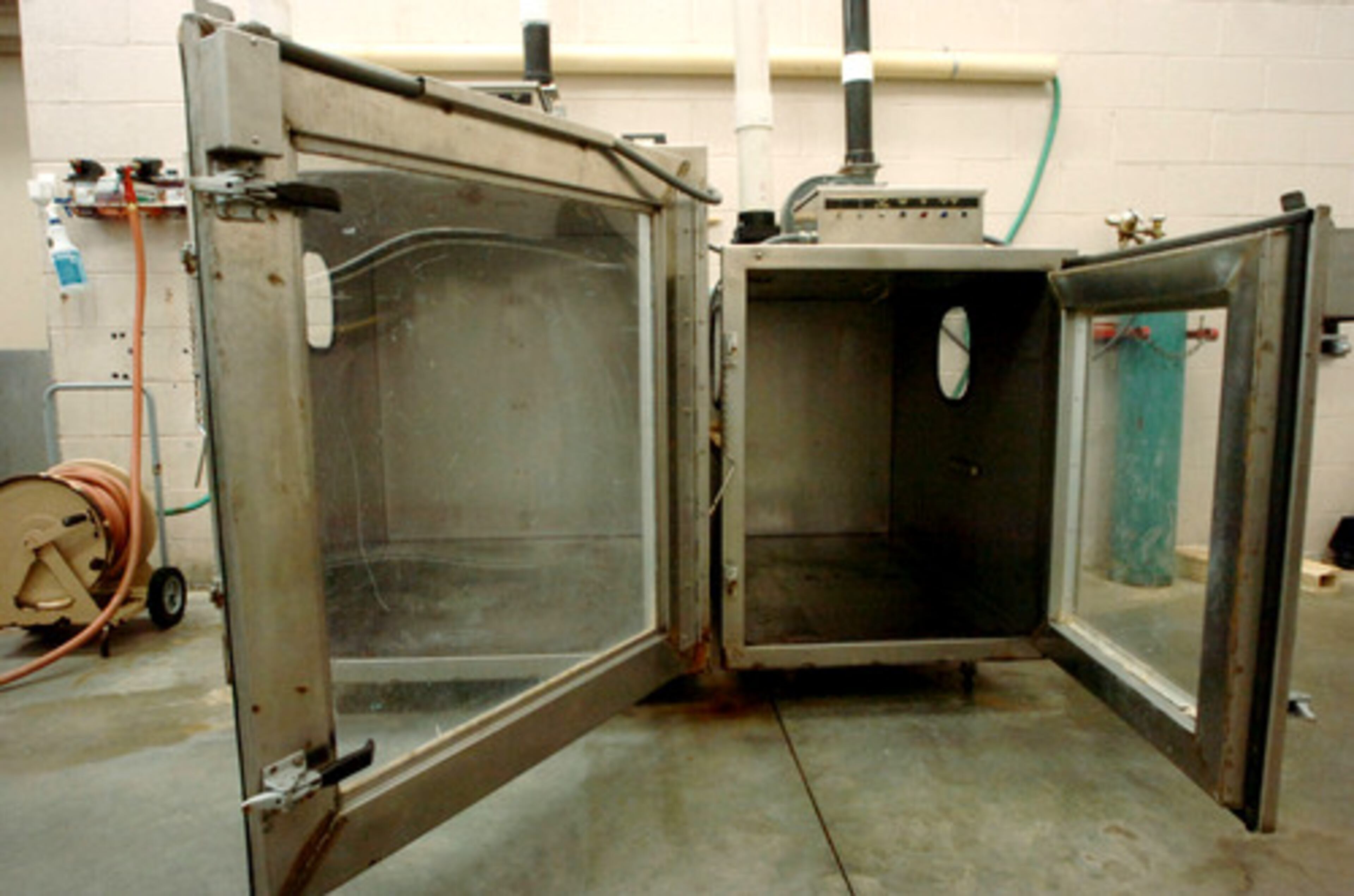 When an animal is euthanized at the shelter, its cage goes into one of two stainless steel gas chambers.